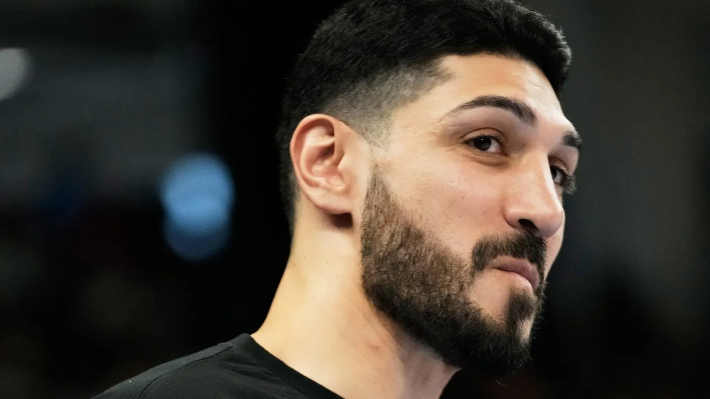 Former NBA center Enes Kanter Freedom watches Indiana Fever players warm up before a WNBA basketball game against the Chicago Sky, Sunday, Aug. 23, 2026, in Chicago. (AP Photo/Nam Y. Huh)