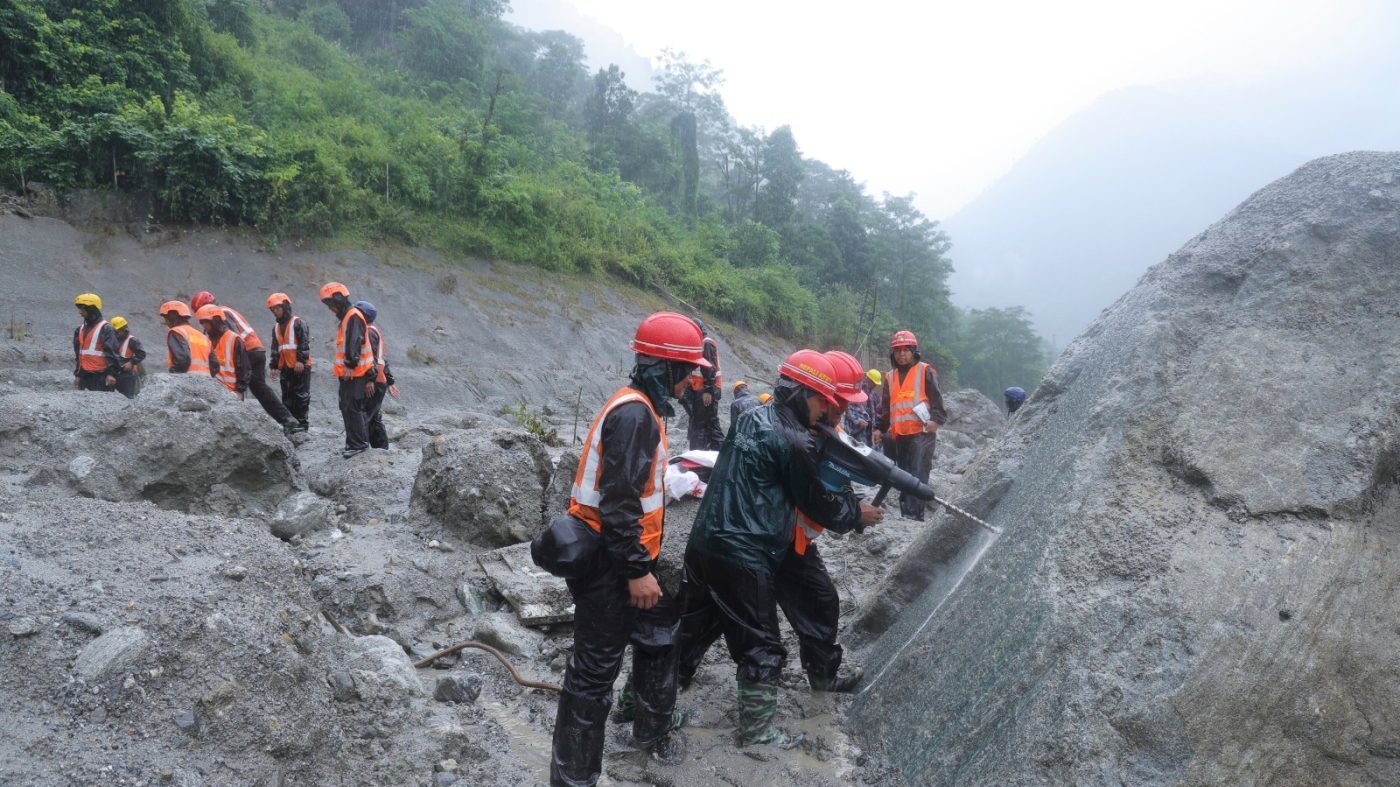 Nepal army soldiers use a drilling machine during a Aug. 30, 2026, rescue operation at the site of a hydropower project in Upper Trishuli, Nepal.
