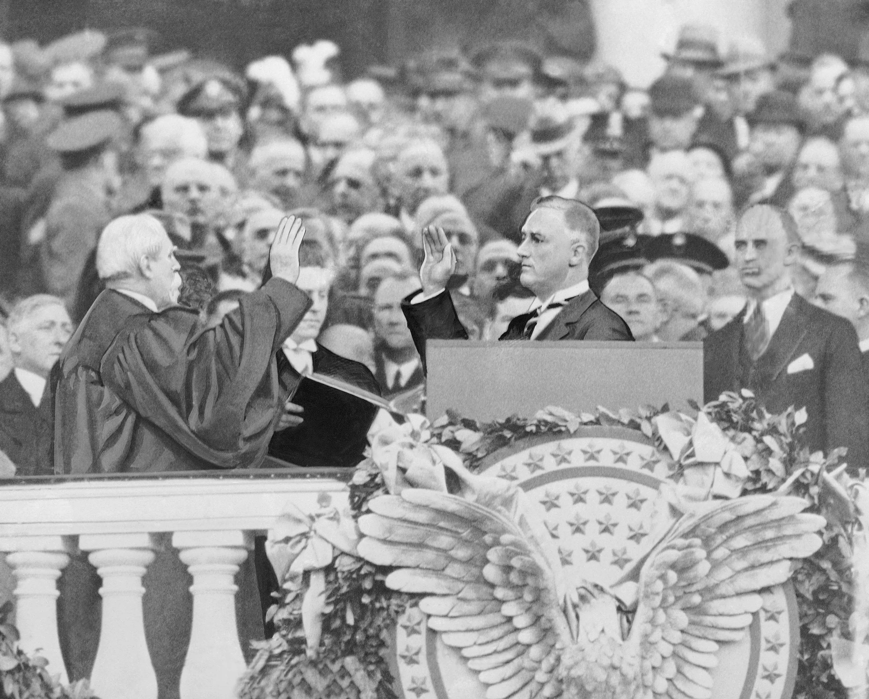 Franklin Delano Roosevelt takes the oath of office as the 32nd president of the United States from Chief Justice Charles Evans Hughes, March 4, 1933. (AP Photo)