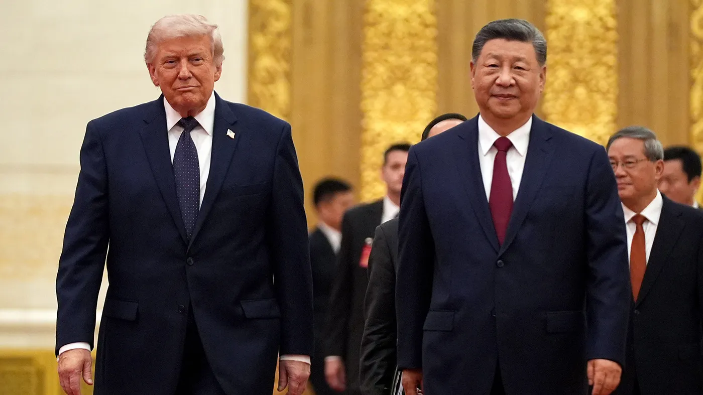 President Donald Trump, left, and Chinese President Xi Jinping arrive during a state dinner at the Great Hall of the People, May 14, 2026, in Beijing.