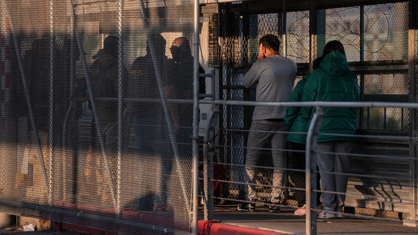 A group of migrants without legal status is deported by U.S. Immigration and Customs Enforcement agents across the McAllen–Hidalgo–Reynosa International Bridge in McAllen, Texas, March 13, 2026.