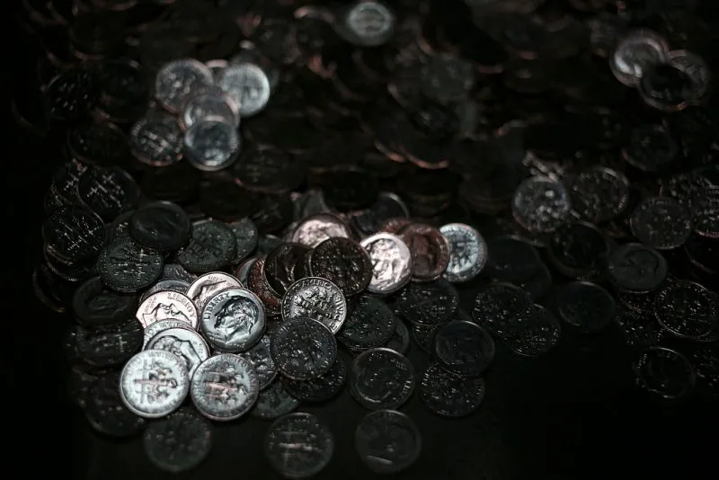 Freshly-minted dimes sit before being counted and packaged at the Denver Mint in Denver, Colorado, U.S., on Wednesday, Oct. 28, 2015. After last week’s two-year bipartisan budget plan that Congress passed to avoid a default on U.S. debt, House and Senate appropriators are already hard at work on the encore act: A $1.1 trillion omnibus spending package needed to keep the government open after Dec. 11. Photographer: Luke Sharrett/Bloomberg via Getty Images