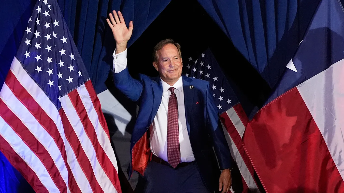 Texas Attorney General Ken Paxton, a Republican candidate for the U.S. Senate, waves as he takes the stage during a primary runoff election night event after winning the Republican party’s nomination, May 26, 2026, in Plano, Texas.