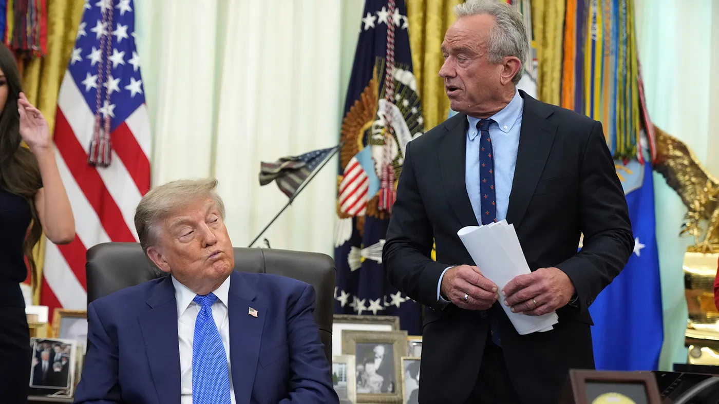 Health and Human Services Secretary Robert F. Kennedy Jr. speaks as President Trump listens during a meeting to sign an executive order about vaccines, Aug. 10, 2026, in the Oval Office of the White House in Washington.