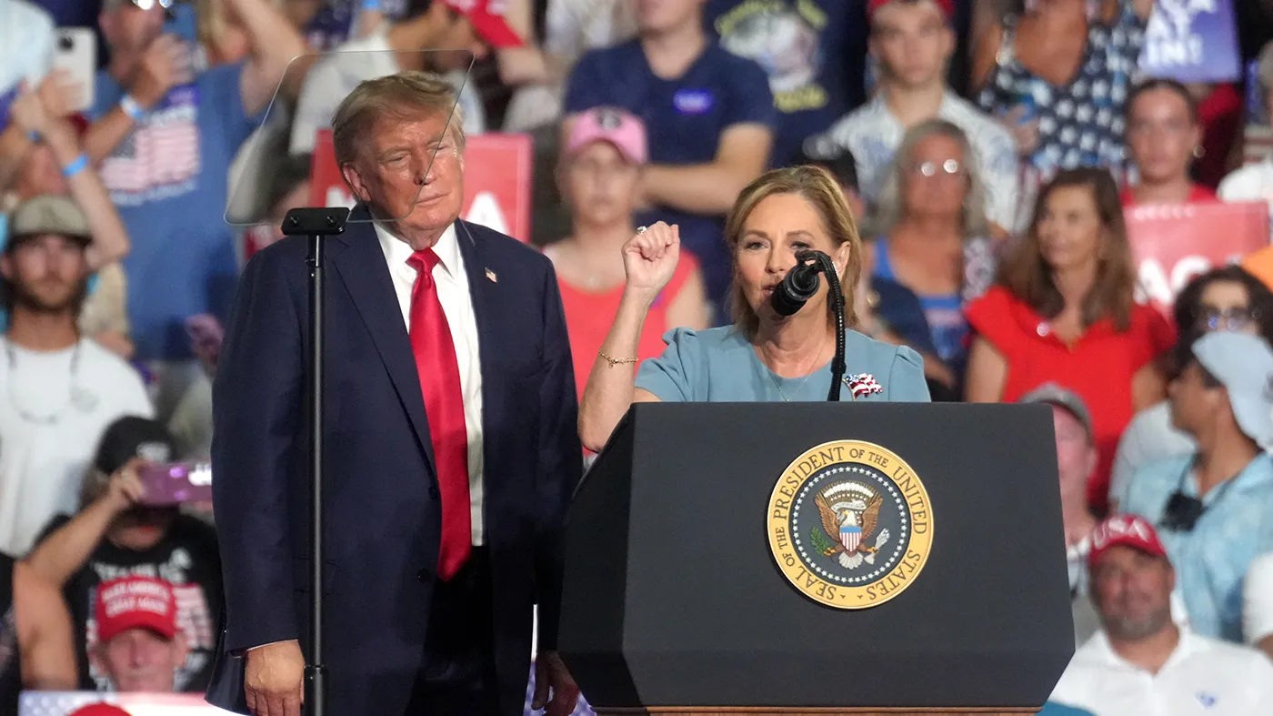 President Trump looks on as Sen. Darline Graham (R-S.C.) speaks at a campaign rally as she competes in a special Republican primary to replace her brother, the late Sen. Lindsey Graham (R-S.C.), Aug. 21, 2026, in Myrtle Beach, S.C. (Meg Kinnard, Associated Press)