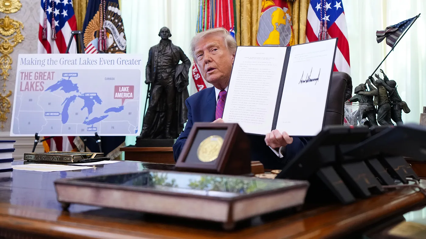 President Trump displays a signed executive order during an event in the Oval Office of the White House on Aug. 27, 2026, in Washington