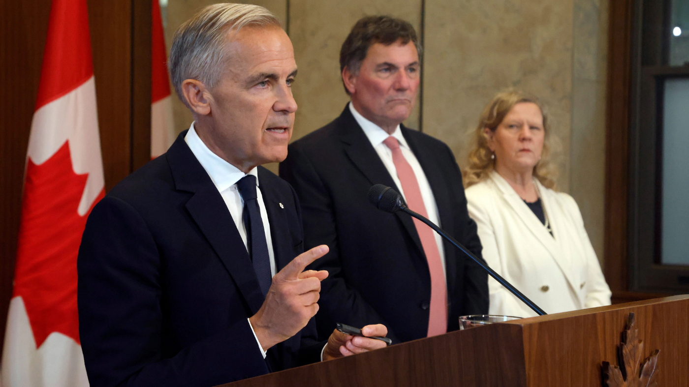 Canadian Prime Minister Mark Carney speaks about Canada’s response to new U.S. tariffs, accompanied by Canada-U.S. Trade Minister Dominic LeBlanc and chief trade negotiator Janice Charette, during a news conference on Parliament Hill in Ottawa on Aug. 22, 2026.