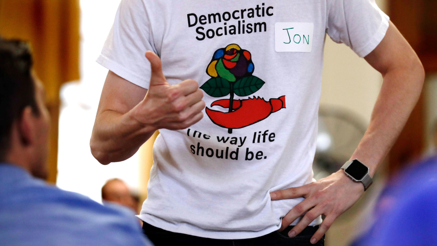 Jon Torsch wears a T-shirt promoting democratic socialism during a gathering of the Southern Maine Democratic Socialists of America at City Hall in Portland, Maine, July 16, 2018.