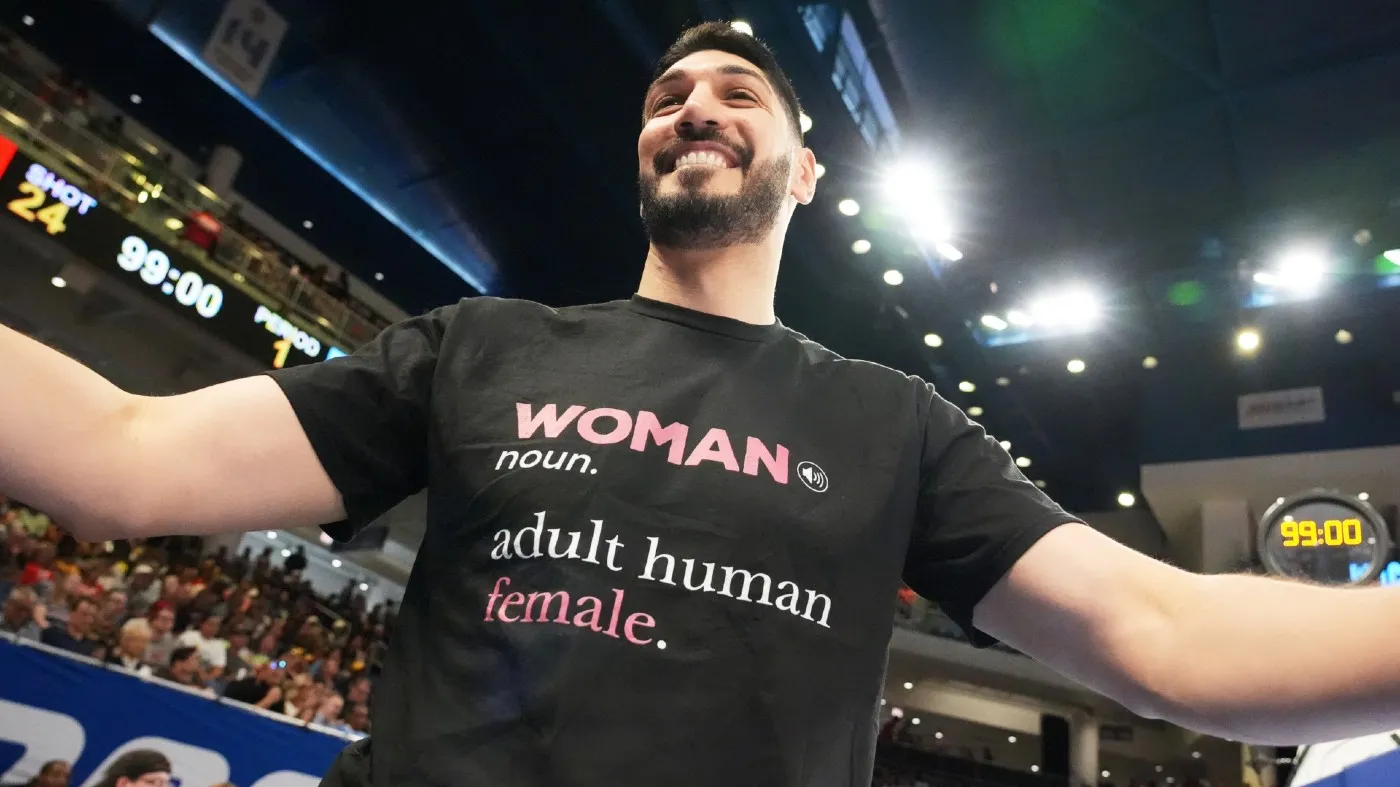 Former NBA center Enes Kanter Freedom greets a friend before a WNBA basketball game between the Indiana Fever and the Chicago Sky, Aug. 23, 2026, in Chicago.