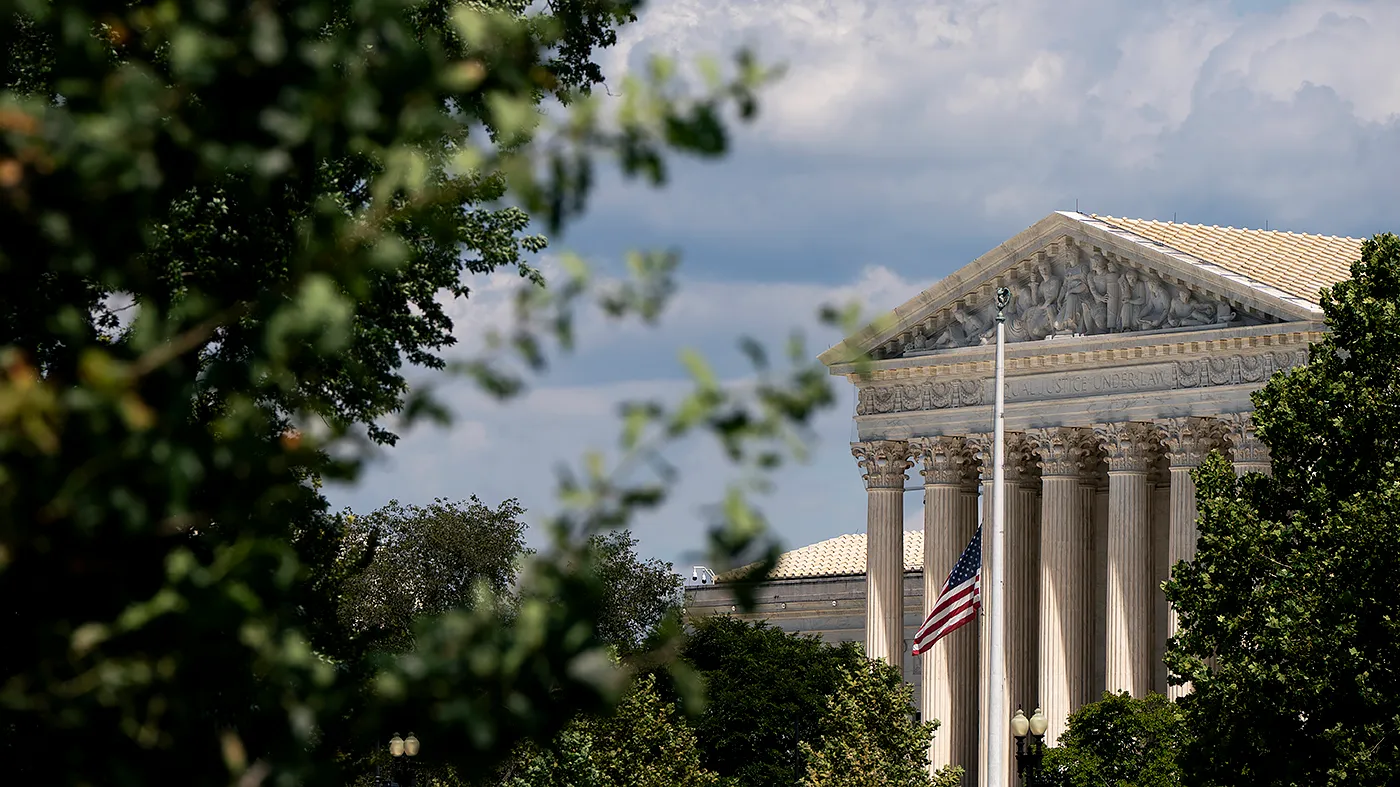 The Supreme Court in Washington, D.C., is seen on Aug. 26, 2026. The American flag is seen at half-staff following the passing of country music legend Dolly Parton at the age of 80 on Aug. 25.