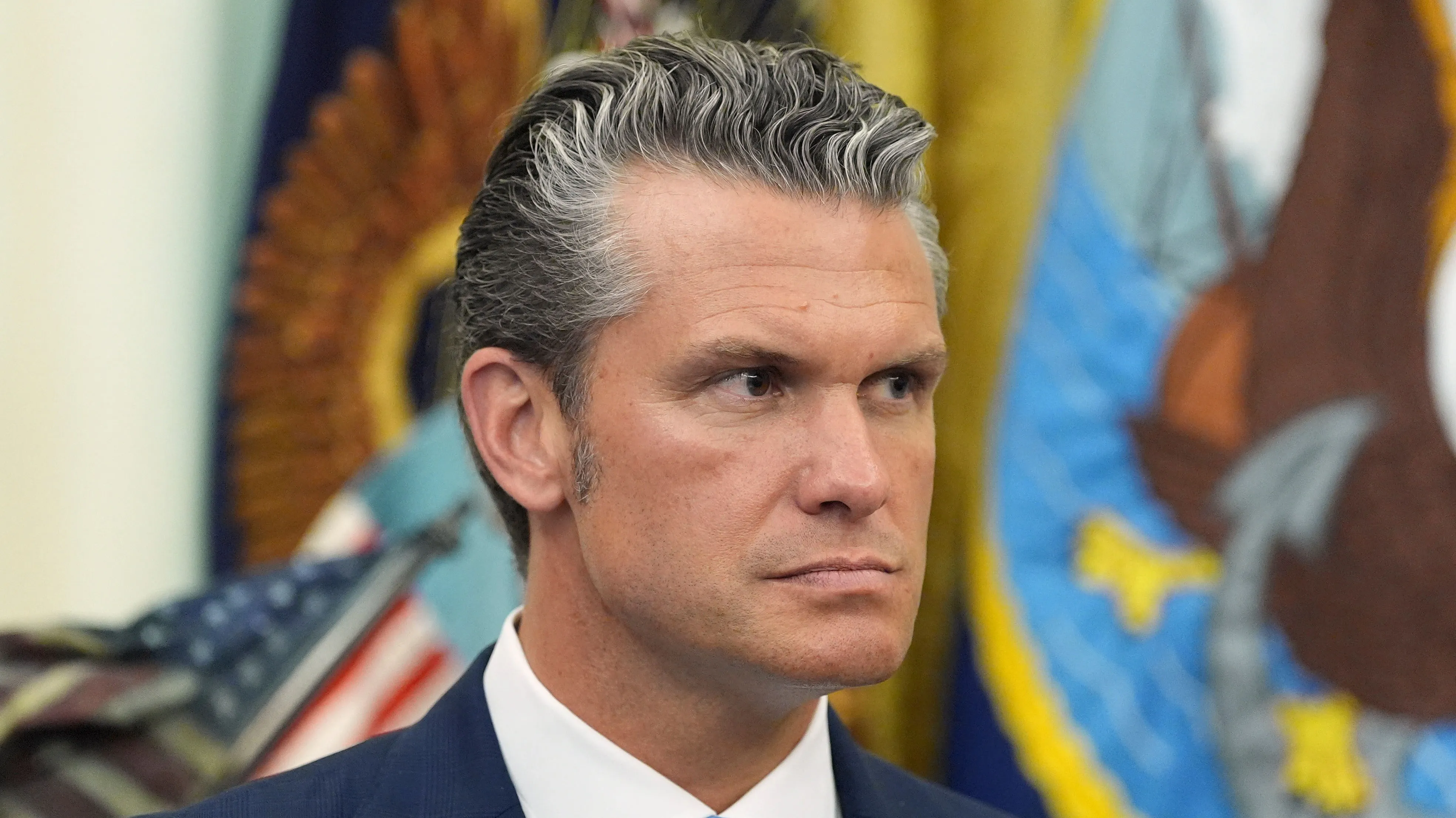 Defense Secretary Pete Hegseth listens as President Trump speaks during a meeting about military families, in the Oval Office of the White House on Aug. 3, 2026, in Washington.