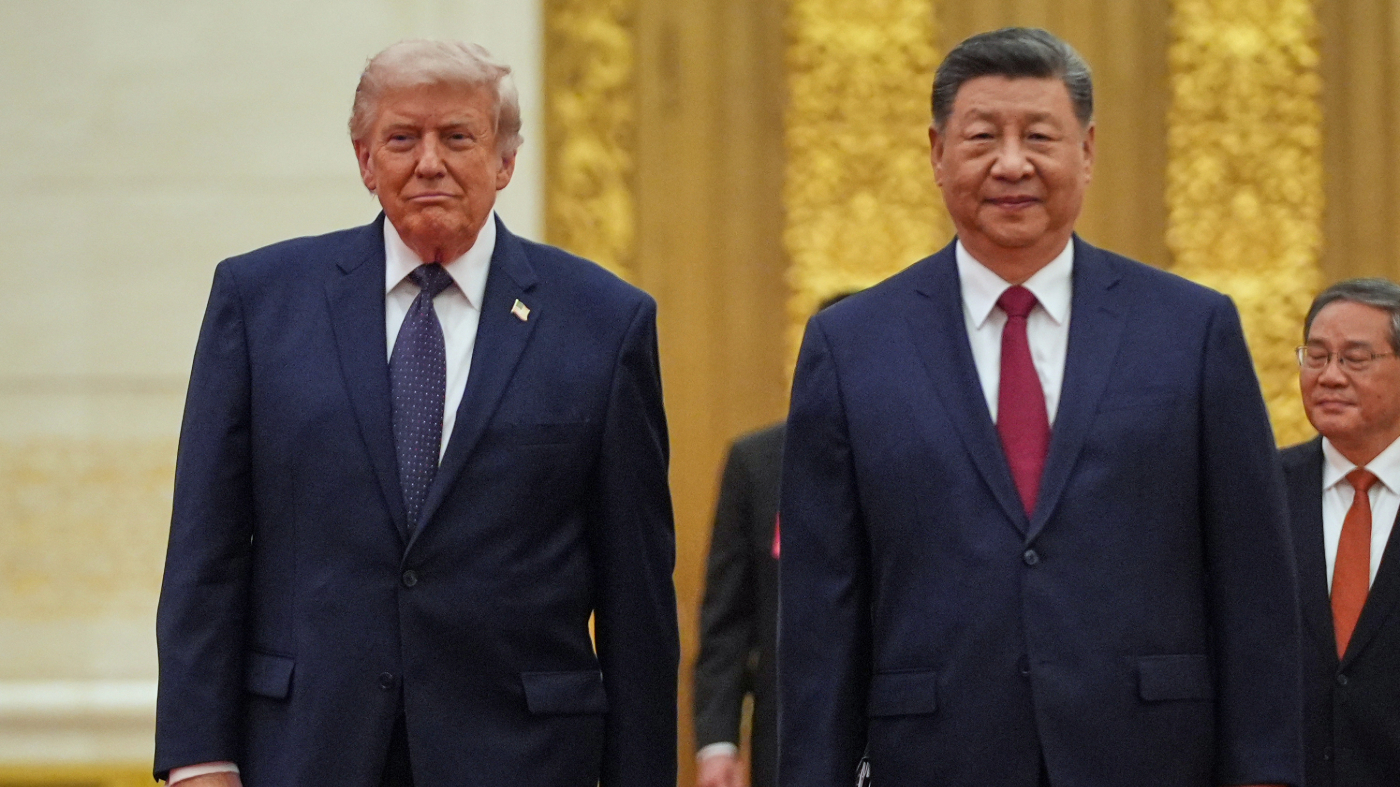 FILE – President Donald Trump, left, and Chinese President Xi Jinping arrive a state dinner at the Great Hall of the People May 14, 2026, in Beijing. (AP Photo/Mark Schiefelbein)