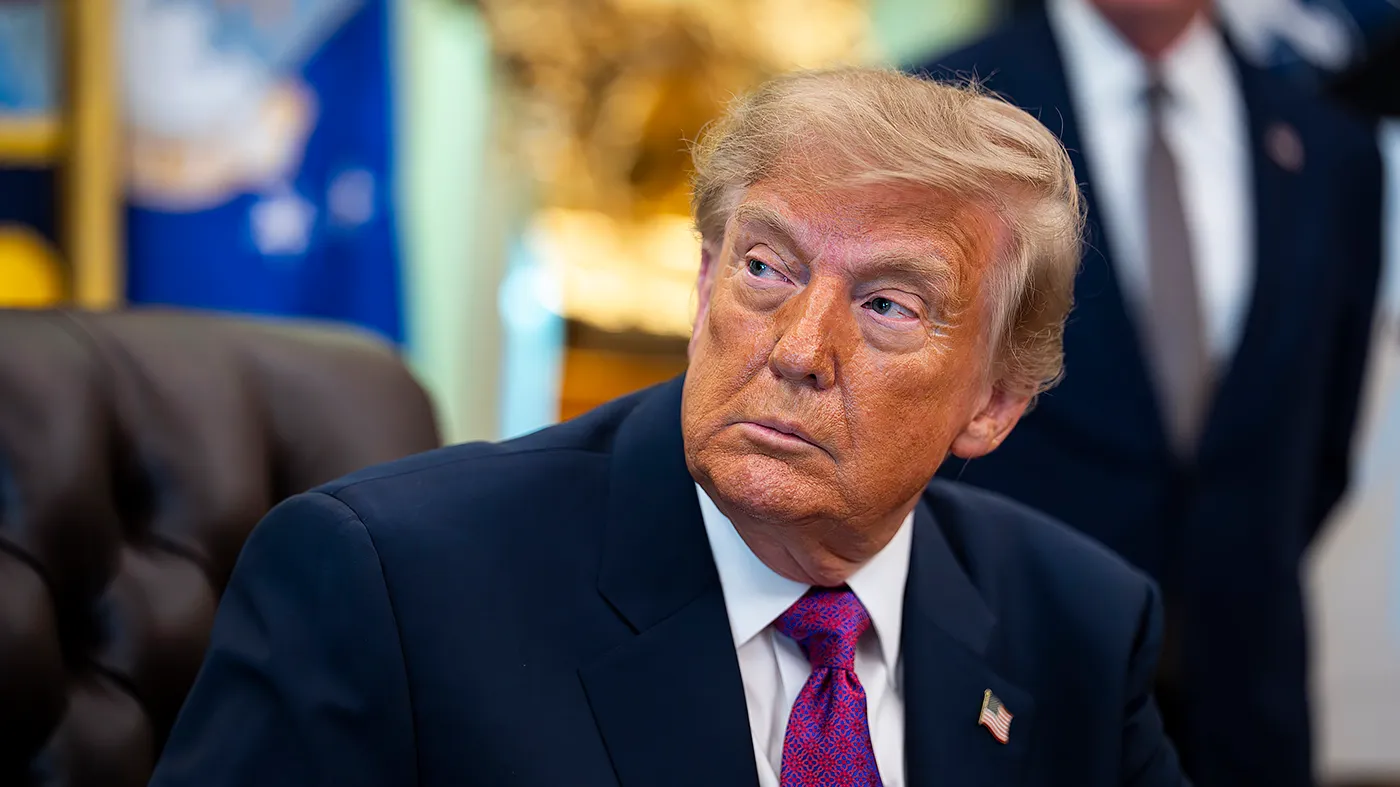 President Trump listens prior to signing an executive order to rename Lake Ontario as Lake” America” amid a recent trade war with Canada, in the Oval Office of the White House in Washington, D.C., on Aug. 27, 2026.