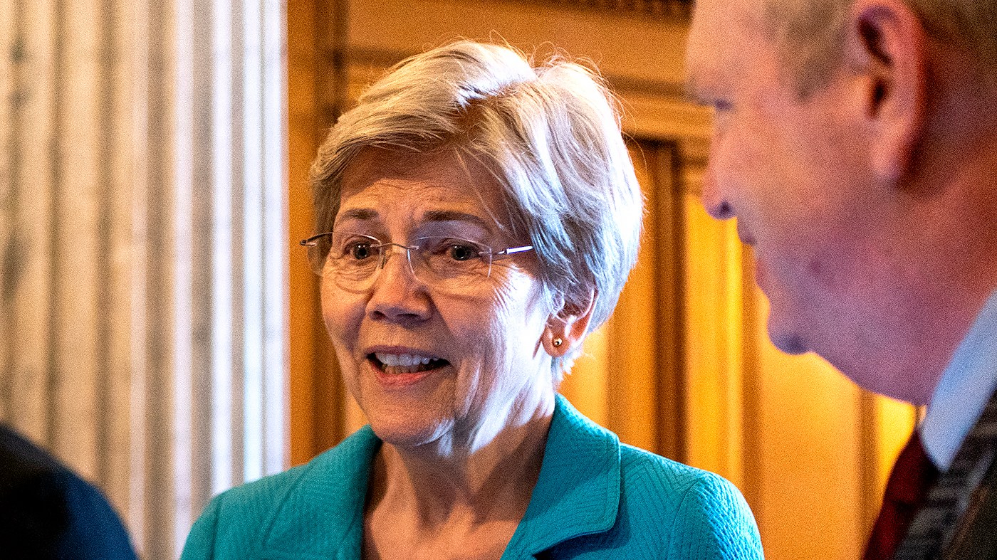 Sen. Elizabeth Warren (D-Mass.) speaks to a reporter as she arrives to the Senate Chamber on Aug. 7, 2026, for a series of votes including a nominations package, Russian sanctions and a continuing resolution to fund the government until Dec. 11.