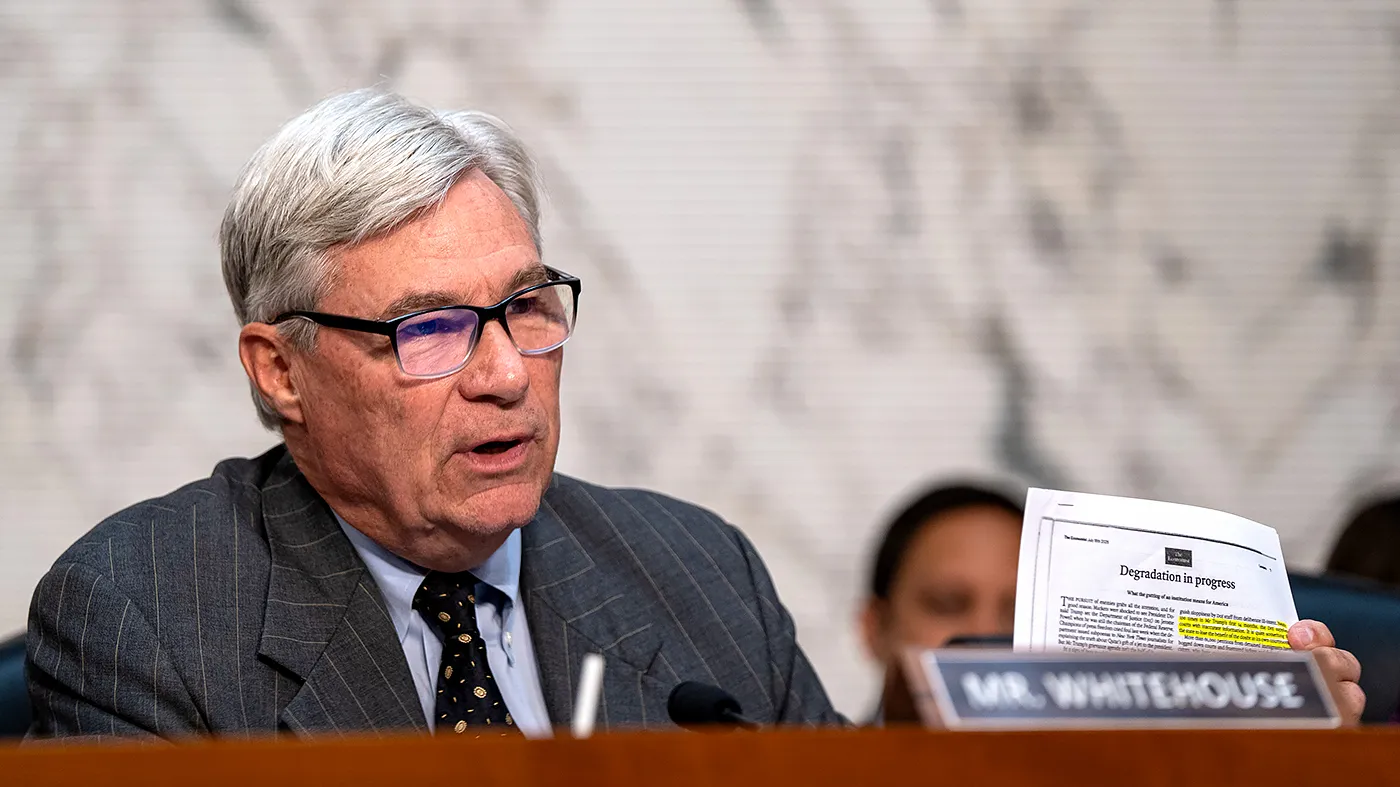 Sen. Sheldon Whitehouse (D-R.I.) holds up an article while he gives his opening statement during the Senate Judiciary Committee business meeting to consider the nomination of then-acting Attorney General Todd Blanche at the Capitol in Washington, D.C., on Aug. 4, 2026.