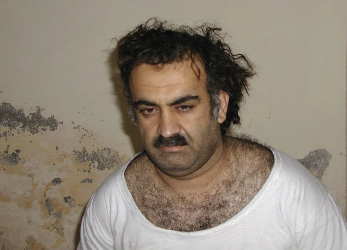 FILE – This Saturday March 1, 2003, photo obtained by The Associated Press shows Khalid Shaikh Mohammad, the alleged Sept. 11 mastermind, shortly after his capture during a raid in Pakistan. The suspected architect of the Sept. 11, 2001, attacks and his fellow defendants may never face the death penalty under plea agreements now under consideration to bring an end to their more than decadelong prosecution, the Pentagon and FBI have advised families of some of the thousands killed. (AP Photo)