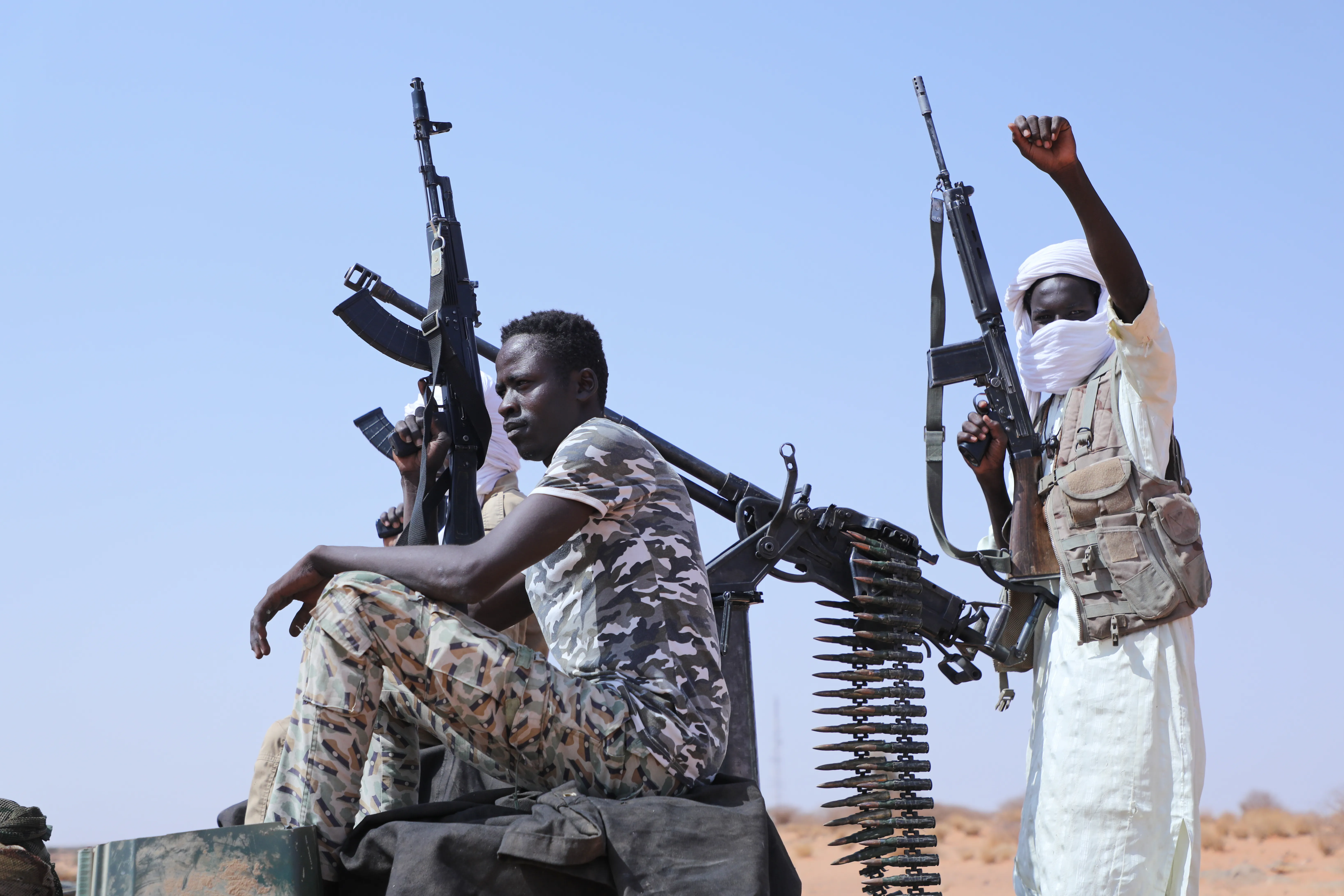 Fighters of armed defectors from the paramilitary Rapid Support Forces (RSF) celebrate, as they are believed to be surrendering to the Sudanese army, in the west of Omdurman, just outside Khartoum, Sudan, on Aug. 19, 2026.
