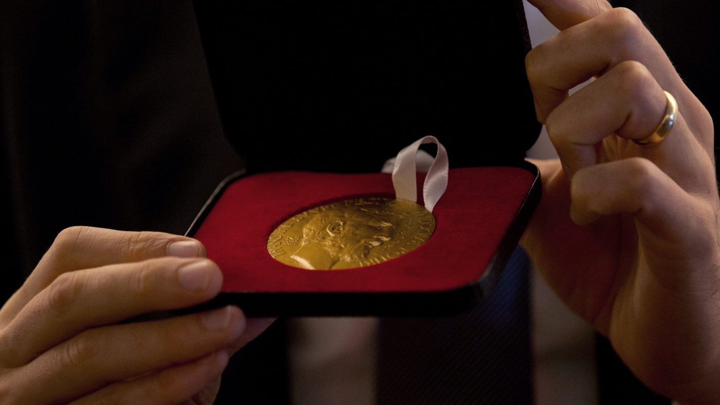 Italy’s Alessio Figalli shows his medal during a press conference during the 2018 International Congress of Mathematicians in Rio de Janeiro, Brazil, Wednesday, Aug. 1, 2018. Figalli was awarded the Fields Medal that is the most prestigious award in the field of mathematics.(AP Photo/Silvia Izquierdo)