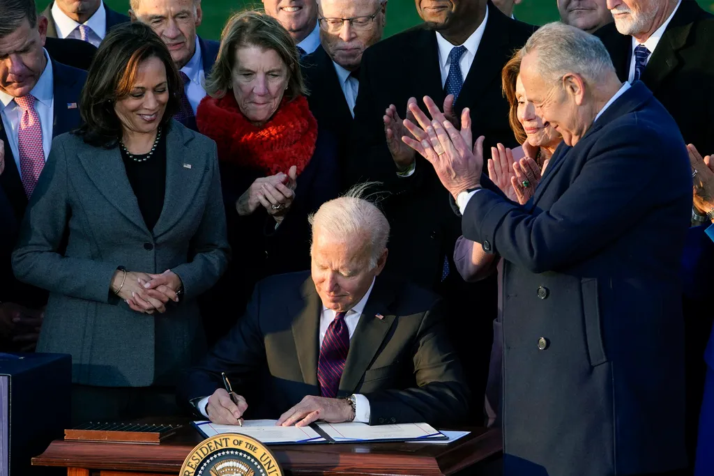 FILE – President Joe Biden signs the $1.2 trillion bipartisan infrastructure bill into law during a ceremony on the South Lawn of the White House in Washington, Nov. 15, 2021. On Tuesday, Feb. 27, 2024, the Biden administration will announce 17 projects across the U.S. to expand renewable energy access in rural areas, particularly for Native American tribes. The projects, which will cost $366 million, are funded by the infrastructure law Biden signed in 2021. (AP Photo/Susan Walsh, File)