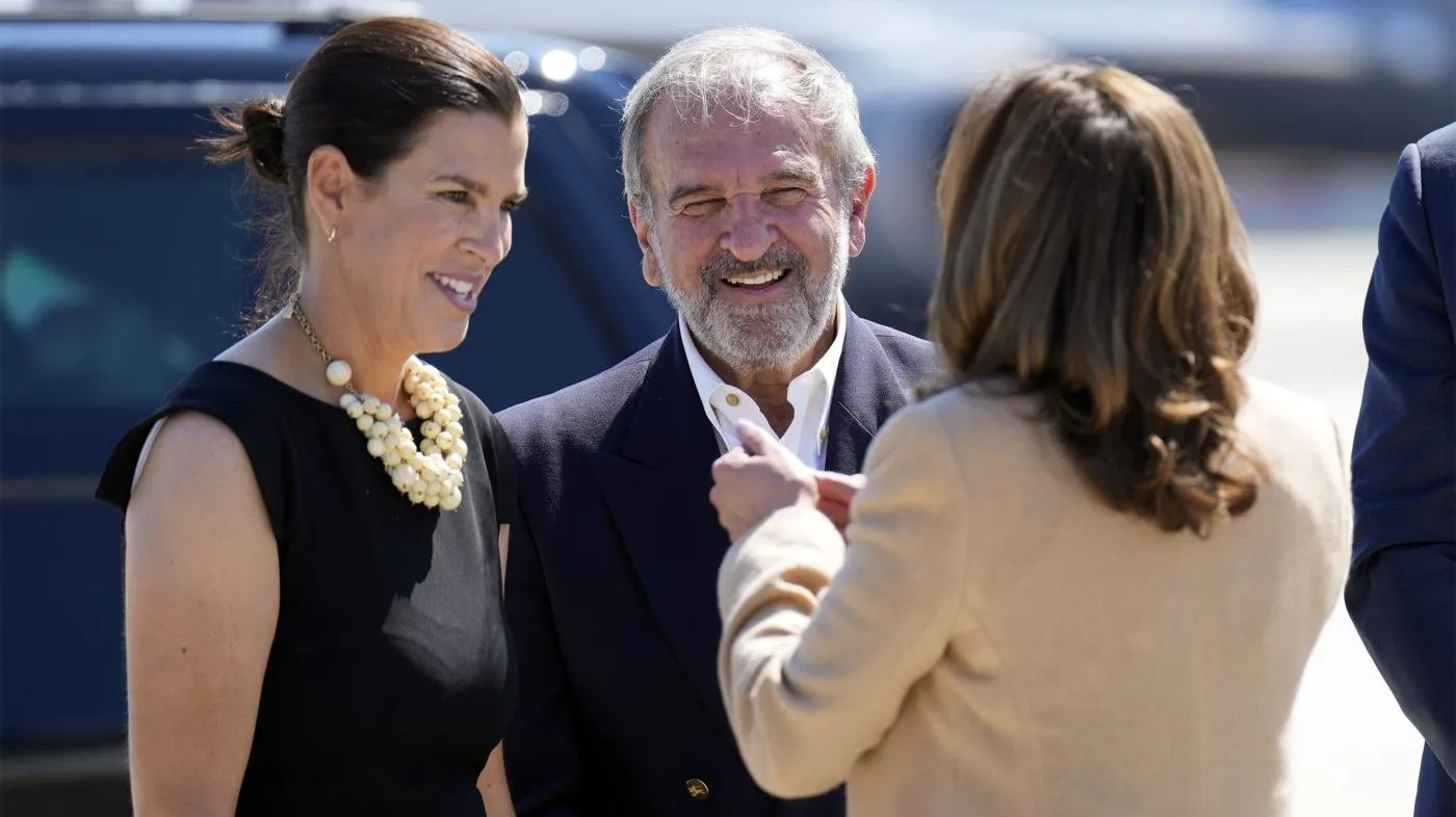 Democratic presidential nominee Vice President Kamala Harris greets Stefany Shaheen and Billy Shaheen, daughter and husband of Sen. Jeanne Shaheen, D-N.H., as she arrives at Portsmouth International Airport in Portsmouth, N.H., for campaign events, Wednesday, Sept. 4, 2024. (AP Photo/Jacquelyn Martin)