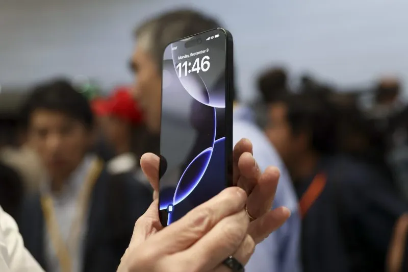 FILE – The new iPhone 16 is displayed during an announcement of new products at Apple headquarters Monday, Sept. 9, 2024, in Cupertino, Calif. (AP Photo/Juliana Yamada, File)
