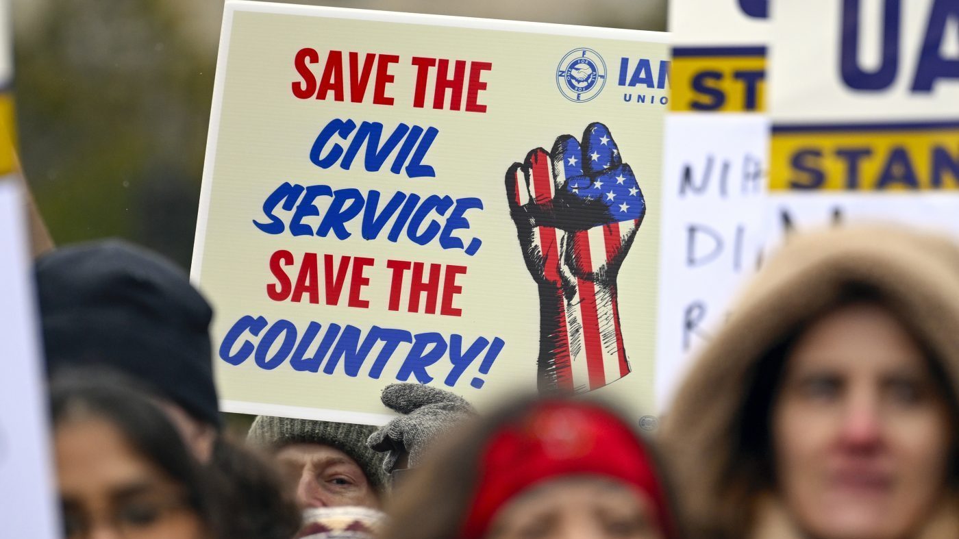 People rally at Health and Human Services headquarters to protest the polices of President Trump and Elon Musk on Feb. 19, 2025, in Washington.
