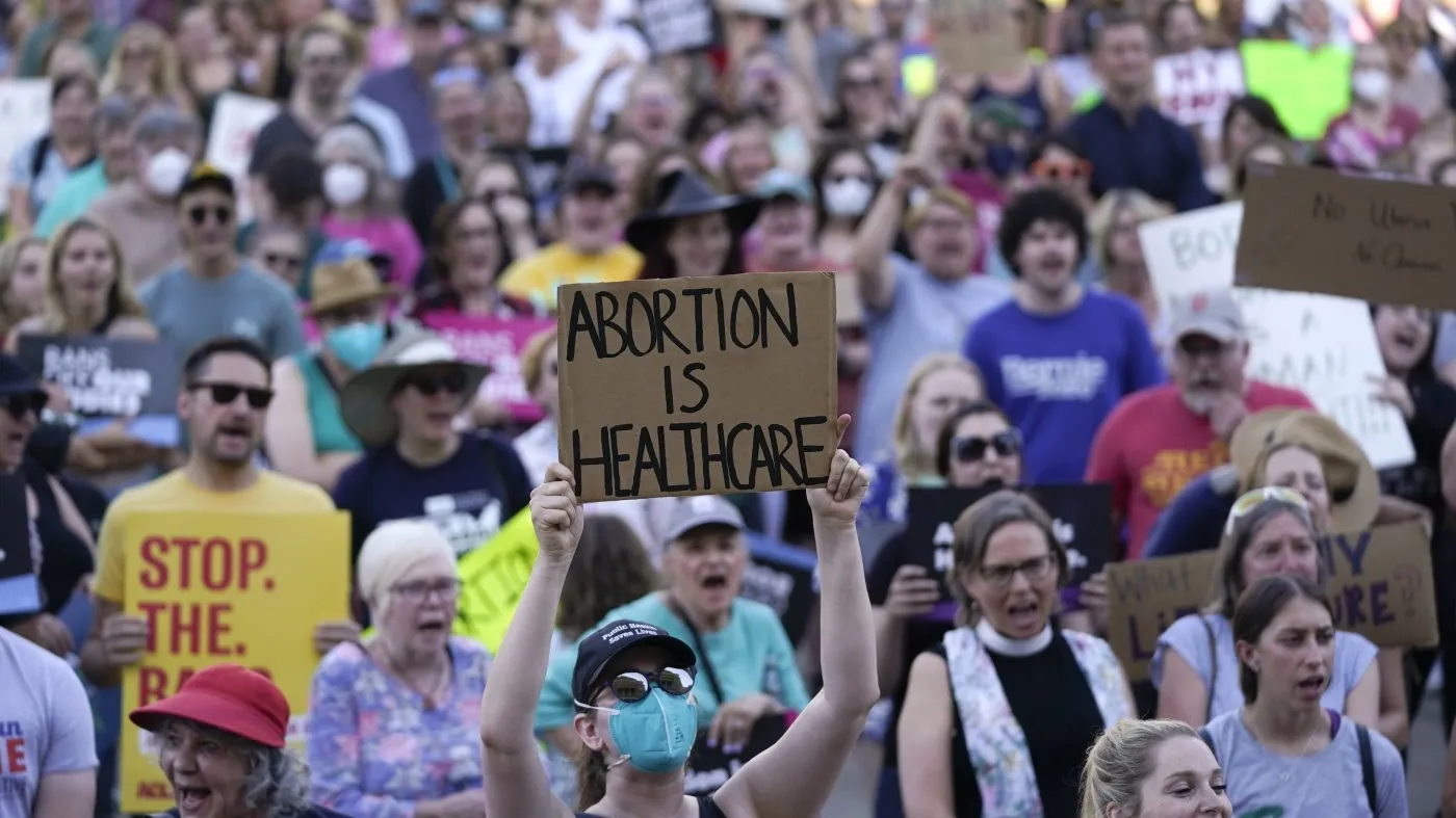 FILE – Abortion-rights protesters demonstrate against the United States Supreme Court’s decision to overturn Roe v. Wade, federally protected right to abortion, outside the state capitol in Lansing, Michigan, June 24, 2022. (AP Photo/Paul Sancya, File)