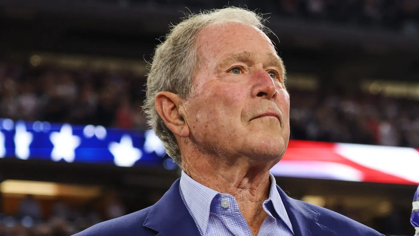 Former President George W. Bush stands during the playing of the national anthem on Nov. 3, 2025, at AT&T Stadium in Arlington, Texas.