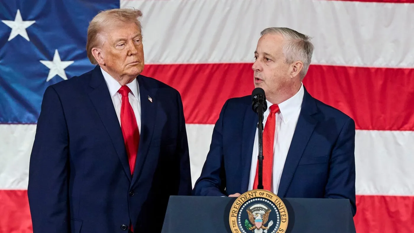 President Donald Trump watches while Republican Senate candidate Michael Whatley speaks to the troops in Fort Bragg, N.C., Friday, Feb. 13, 2026. (AP Photo/Matt Ramey)