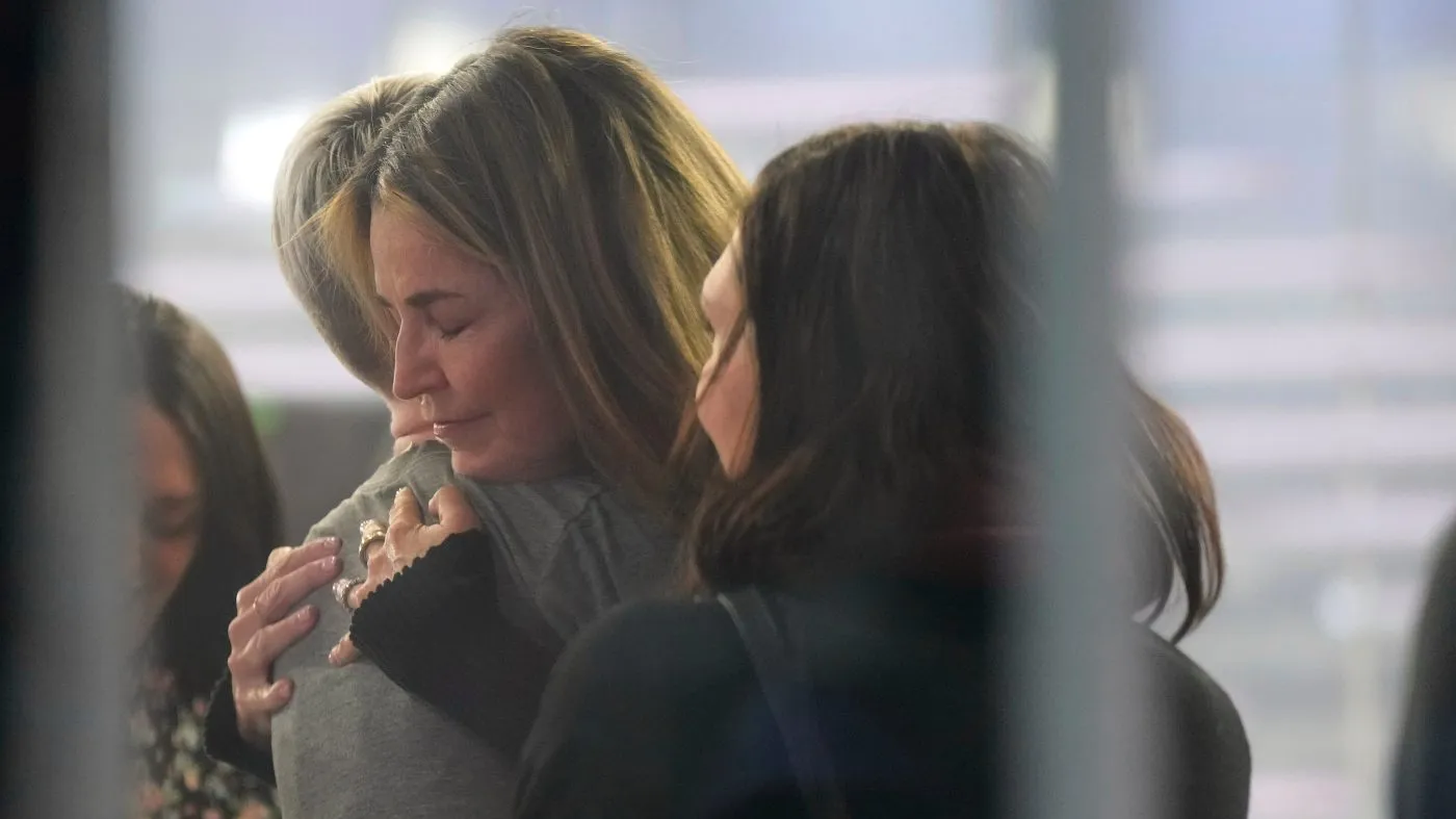 Savannah Guthrie hugs a staff member during a visit to the Today show at Rockefeller Plaza in New York on Thursday, March 5, 2026. (Photo by Charles Sykes/Invision/AP)