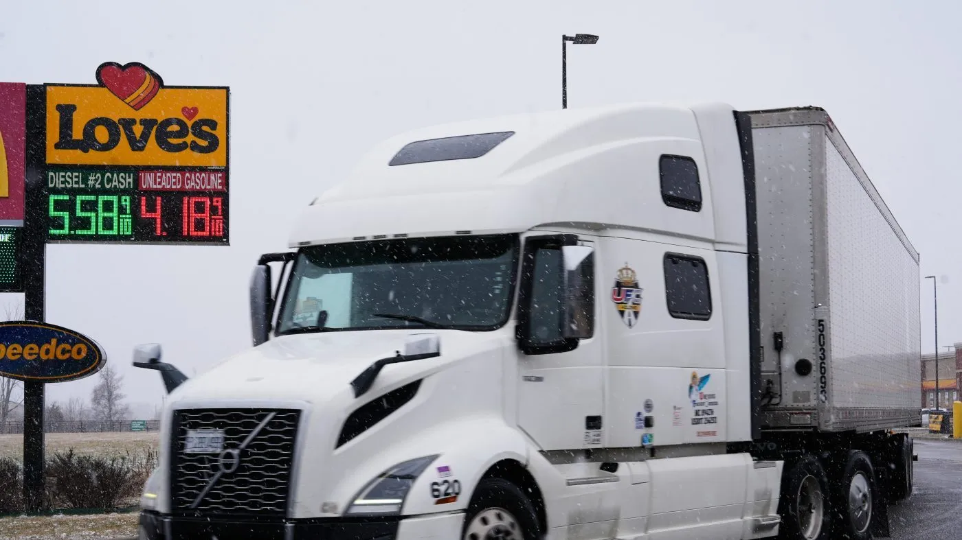 A semi-trailer truck leaves the Loves Travel Stop after refueling with diesel, March 23, 2026, in St. Clair, Mich.