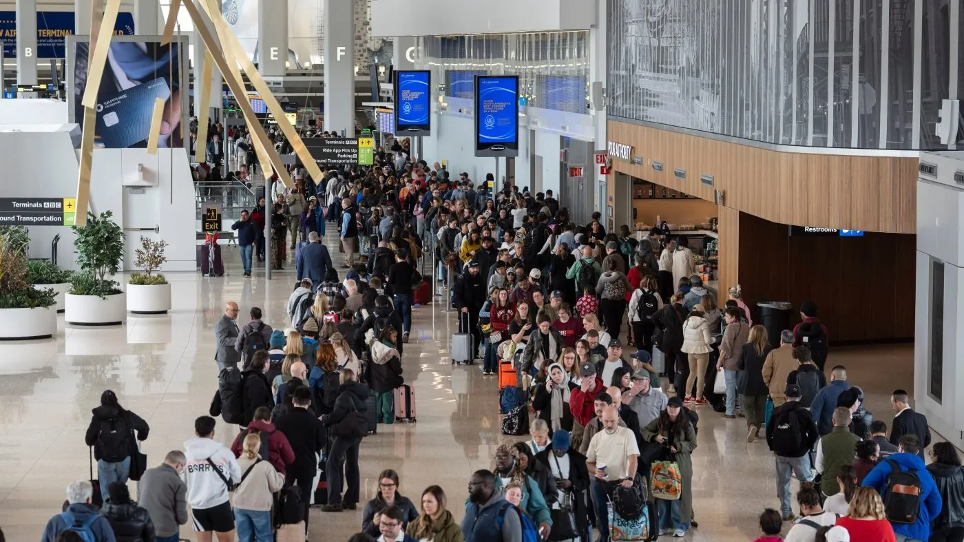 Travelers wait in a TSA line, Wednesday, March 25, 2026, at LaGuardia Airport in New York. (AP Photo/Yuki Iwamura)