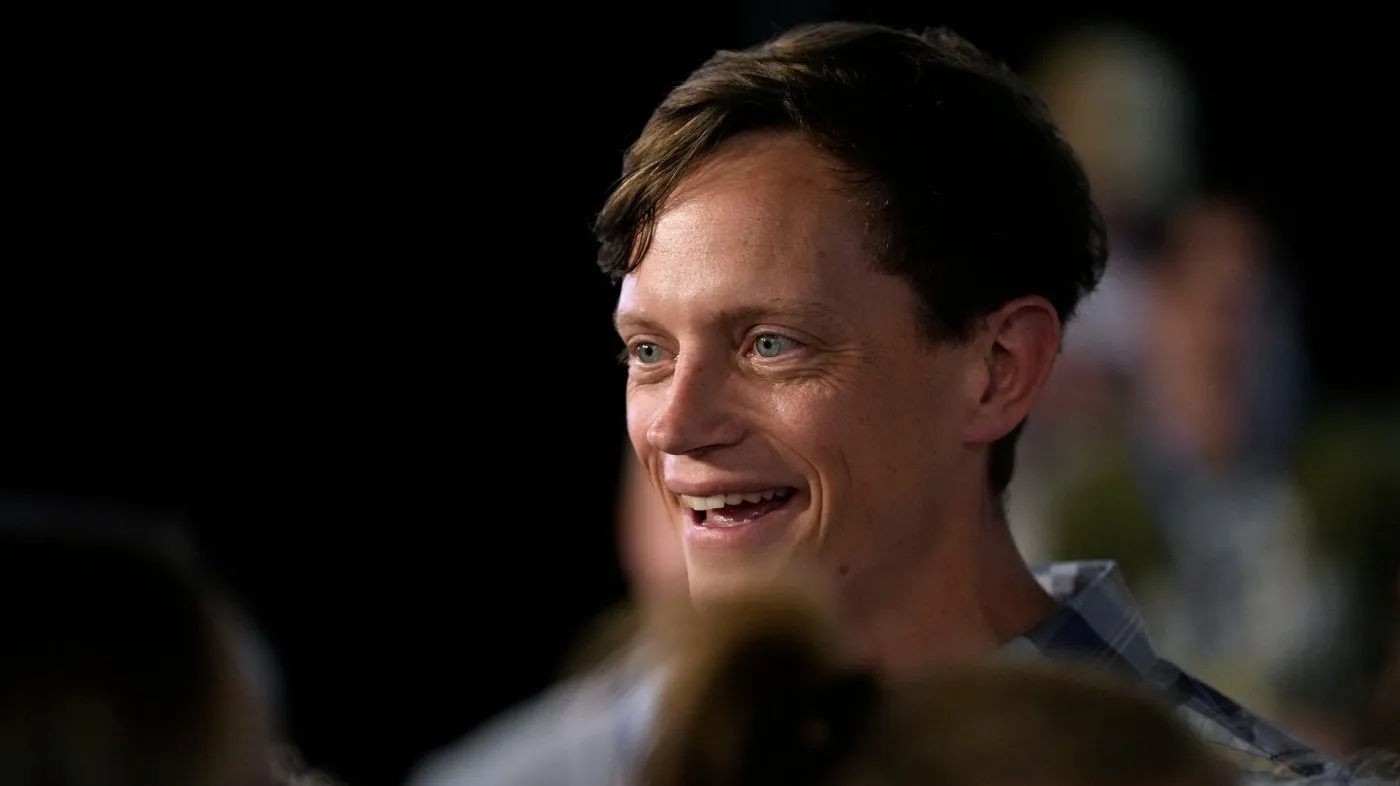 Iowa Democratic gubernatorial candidate Rob Sand talks with supporters during a campaign rally, Sunday, June 7, 2026, in Des Moines, Iowa. (AP Photo/Charlie Neibergall)