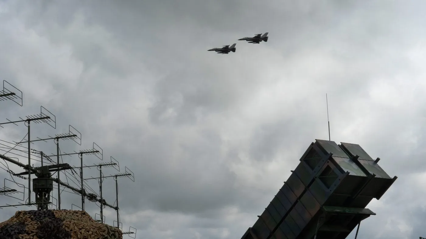 FILE – Ukrainian Air Force’s F-16 fighter jets fly over a Patriot Air and Missile Defense System in an undisclosed location in Ukraine, on Aug. 4, 2024. (AP Photo/Efrem Lukatsky, File)