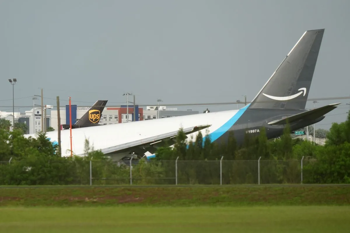 An Amazon cargo plane sits at the Miami International Airport (MIA) after it overshot the runway, Sunday, Sept. 6, 2026. (AP Photo/Lynne Sladky)
