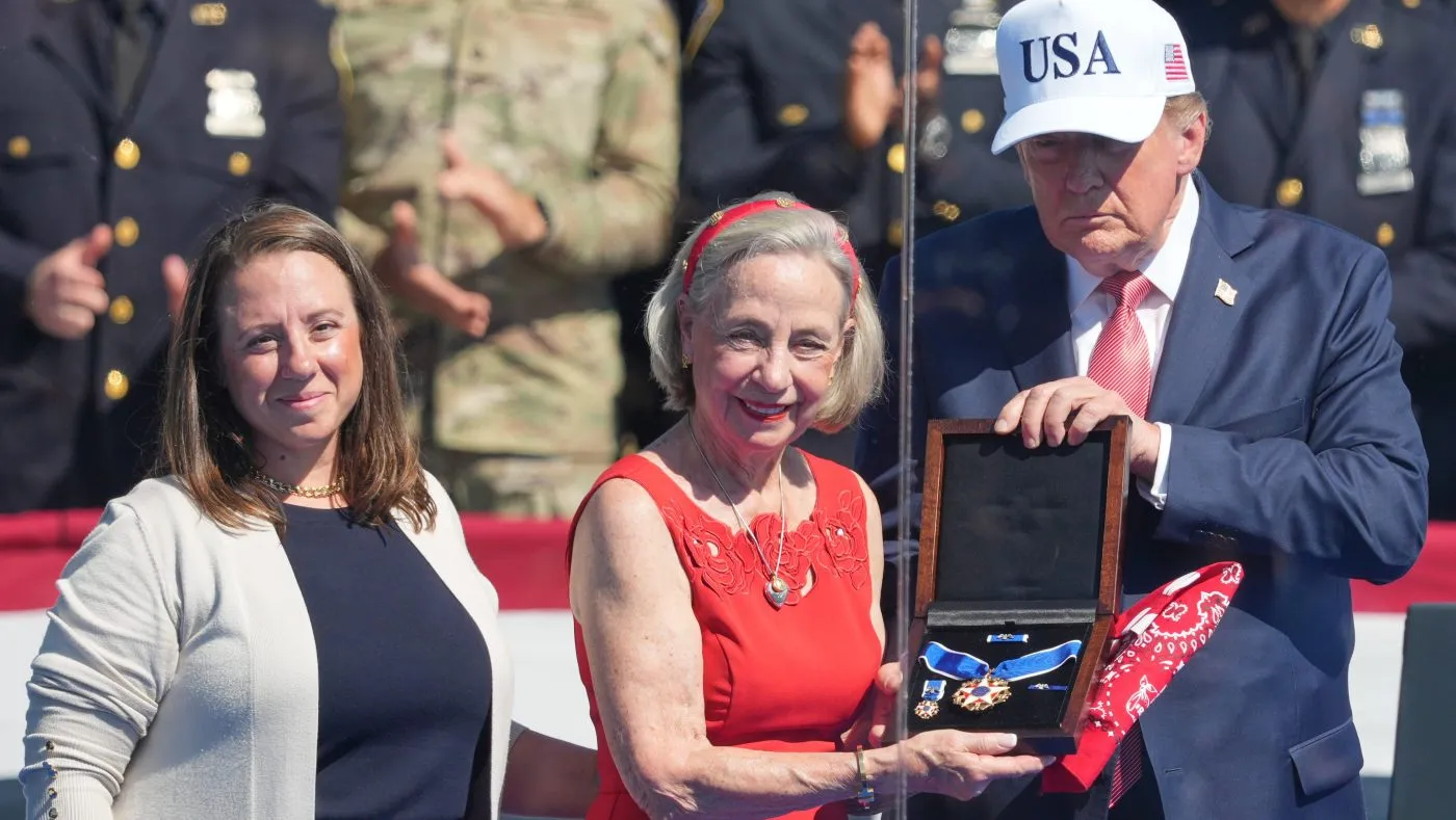 President Trump posthumously awards the Presidential Medal of Freedom to 9/11 hero Welles Crowther, accepted by Alison Crowther, Welles’s mother, on his behalf, during a Steel Across America event with the Tunnel to Towers Foundation on the Ellipse, Sept. 8, 2026, in Washington, as sister, Paige Crowther Charbonnea, left, looks on.