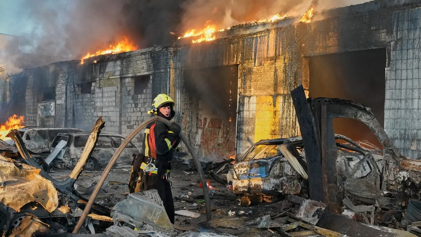 Firefighters put out a fire during Russian massive air attack in Kyiv, Ukraine, Sept. 8, 2026.