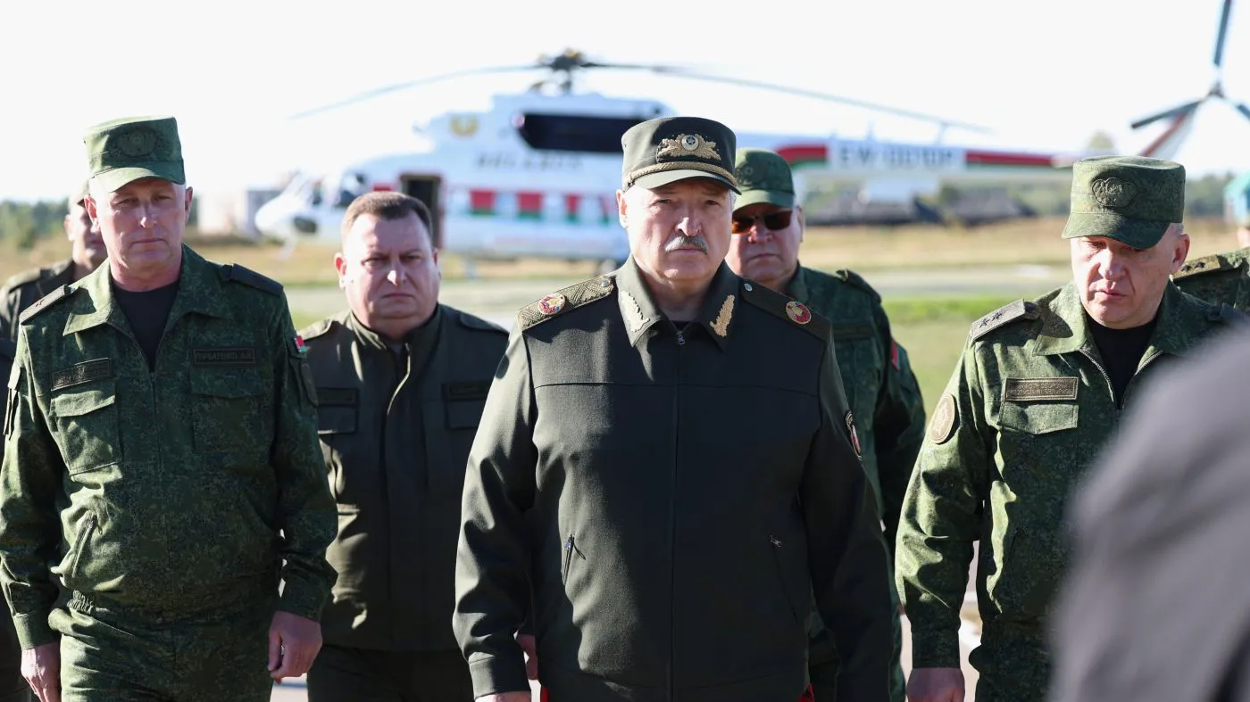In this photo released by the Belarusian Presidential Press Service, Belarusian President Alexander Lukashenko, center, visits the Obuz-Lesnovsky combined-arms training ground in Belarus, Sept. 11, 2026.