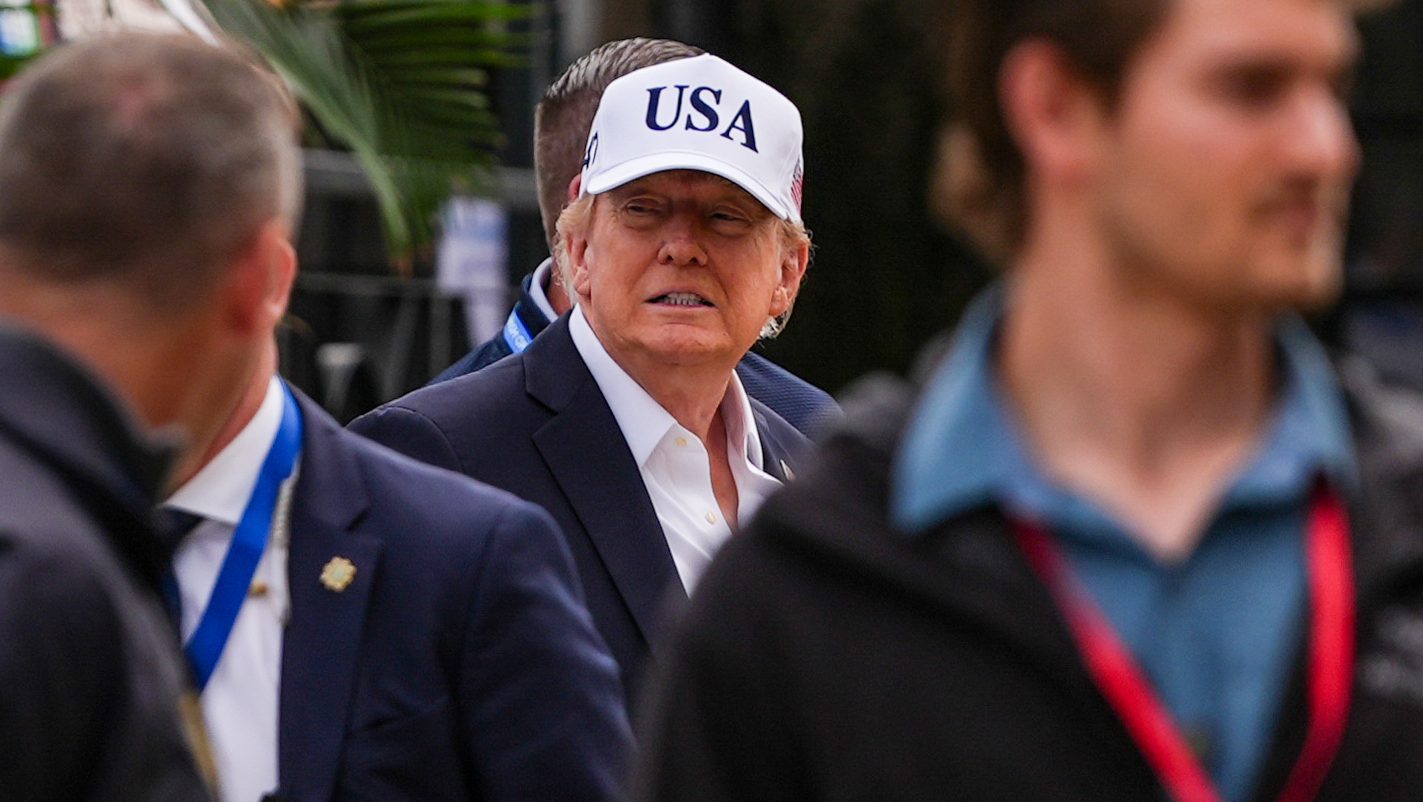 U.S. President Donald Trump, center, attends the Irish Open golf tournament at Trump International Golf Links in Doonbeg, Ireland, Sunday, Sept. 13, 2026. (AP Photo/Julia Demaree Nikhinson)