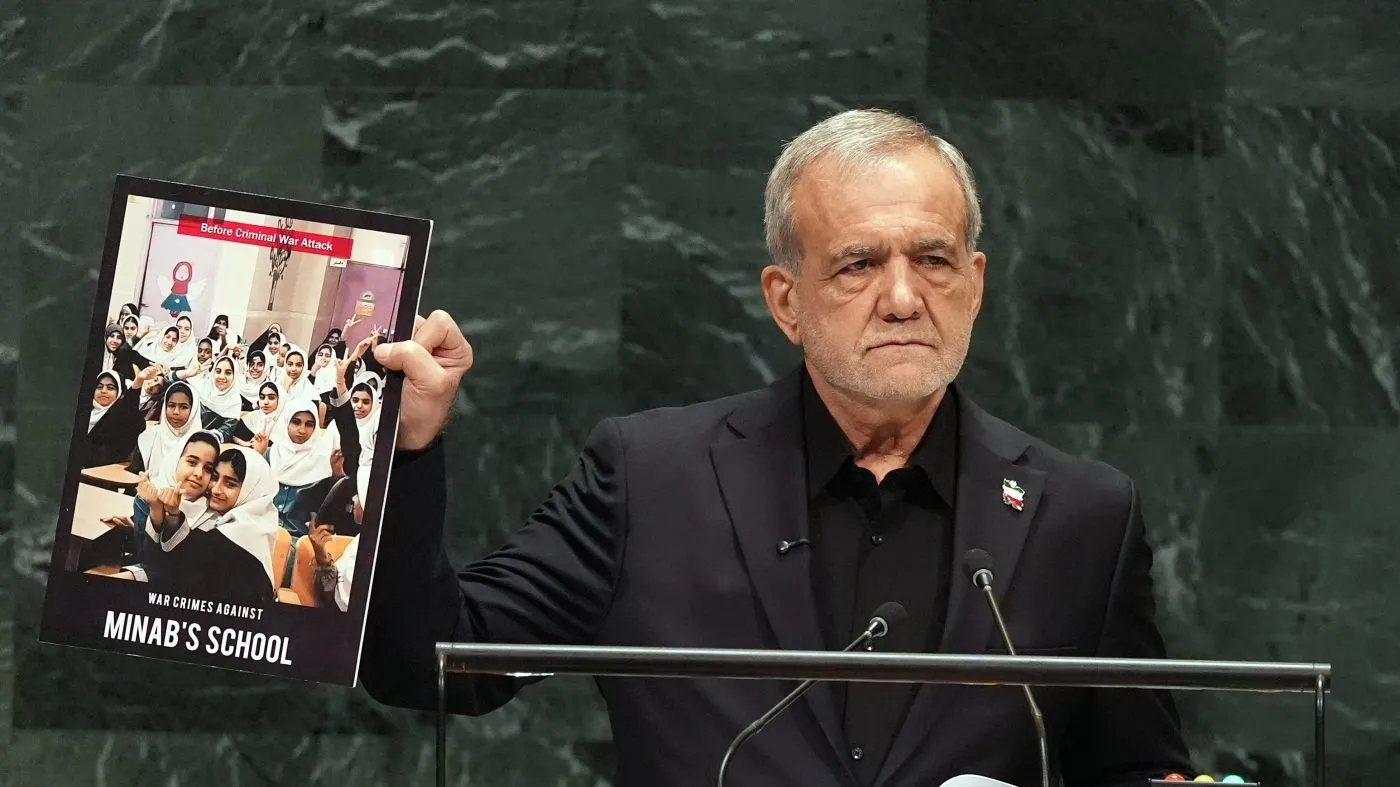 Iran’s President Masoud Pezeshkian holds up a photograph as he delivers remarks during the 81st session of the United Nations General Assembly at United Nations headquarters, Wednesday, Sept. 23, 2026. (AP Photo/Heather Khalifa)