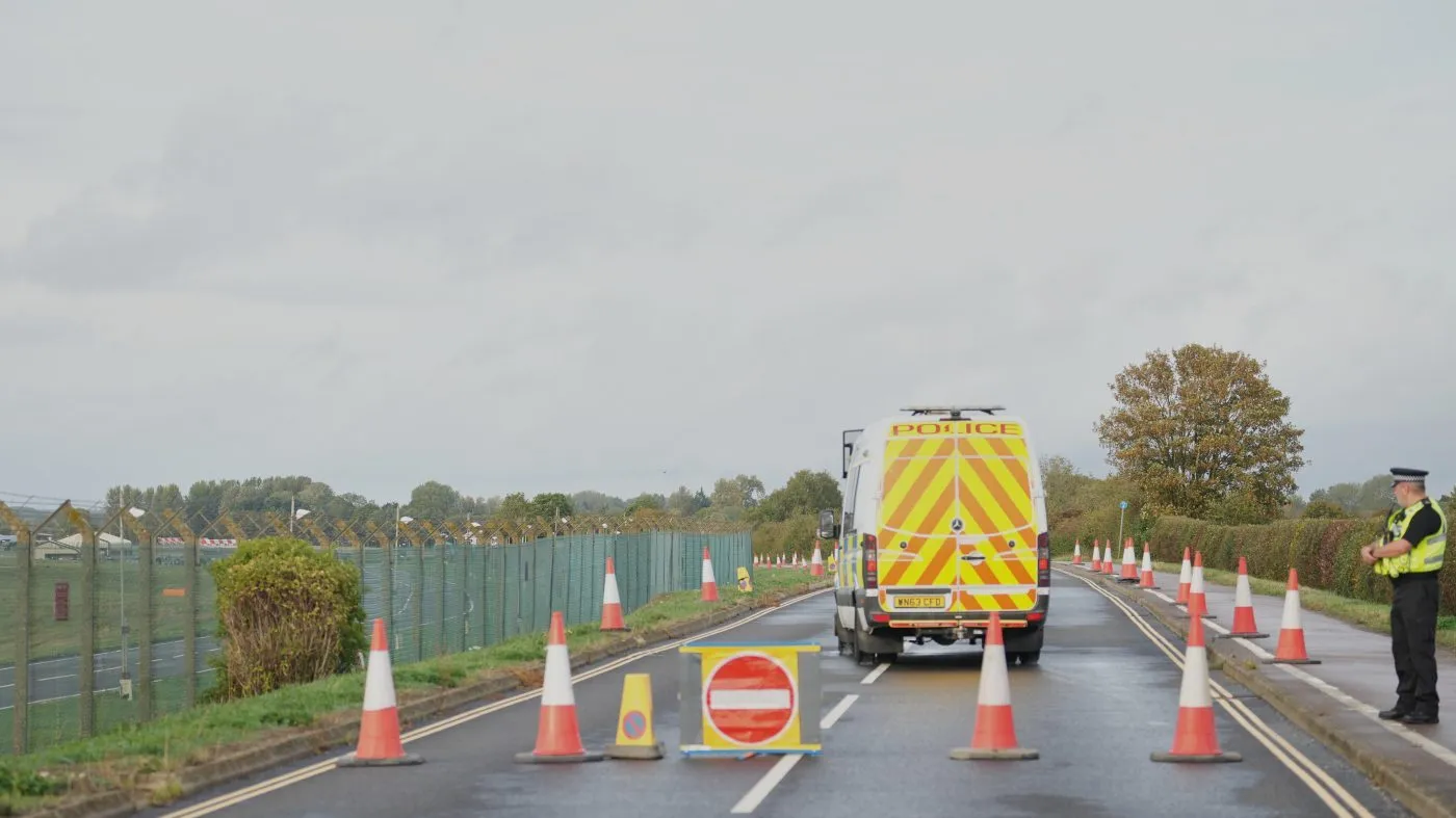 Police guard a road leading to RAF Fairford, a US Airbase, after an incident in Fairford, England , Sunday, Sept. 27, 2026. (AP Photo/Alastair Grant)