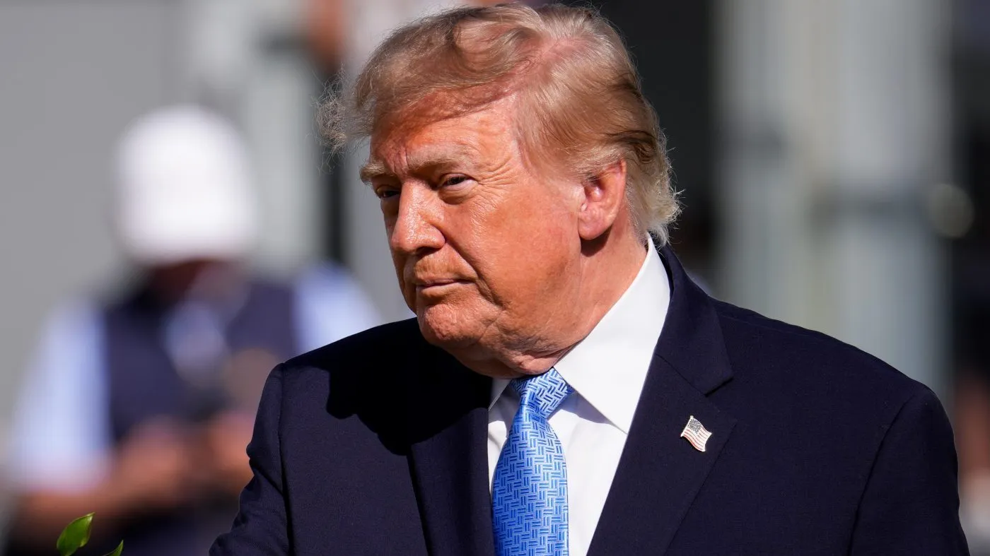 President Trump motions on the first tee box prior to the Presidents Cup golf tournament final round singles matches between the USA and International teams at Medinah Country Club, Sept. 27, 2026, in Medinah, Ill.