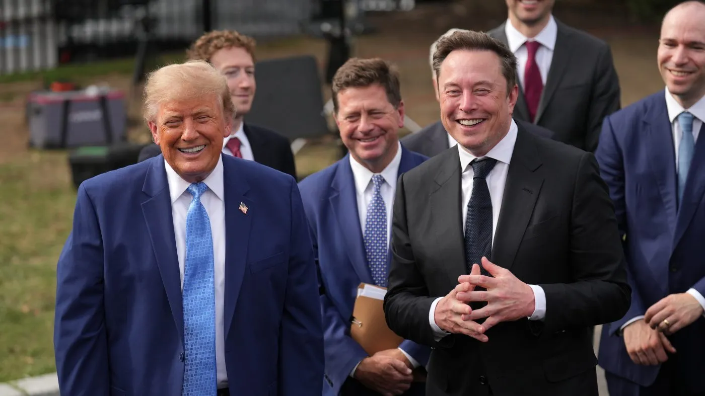 President Trump smiles as Elon Musk speaks to reporters at the White House in Washington Sept. 29, 2026, after meeting with top executives of AI firms.