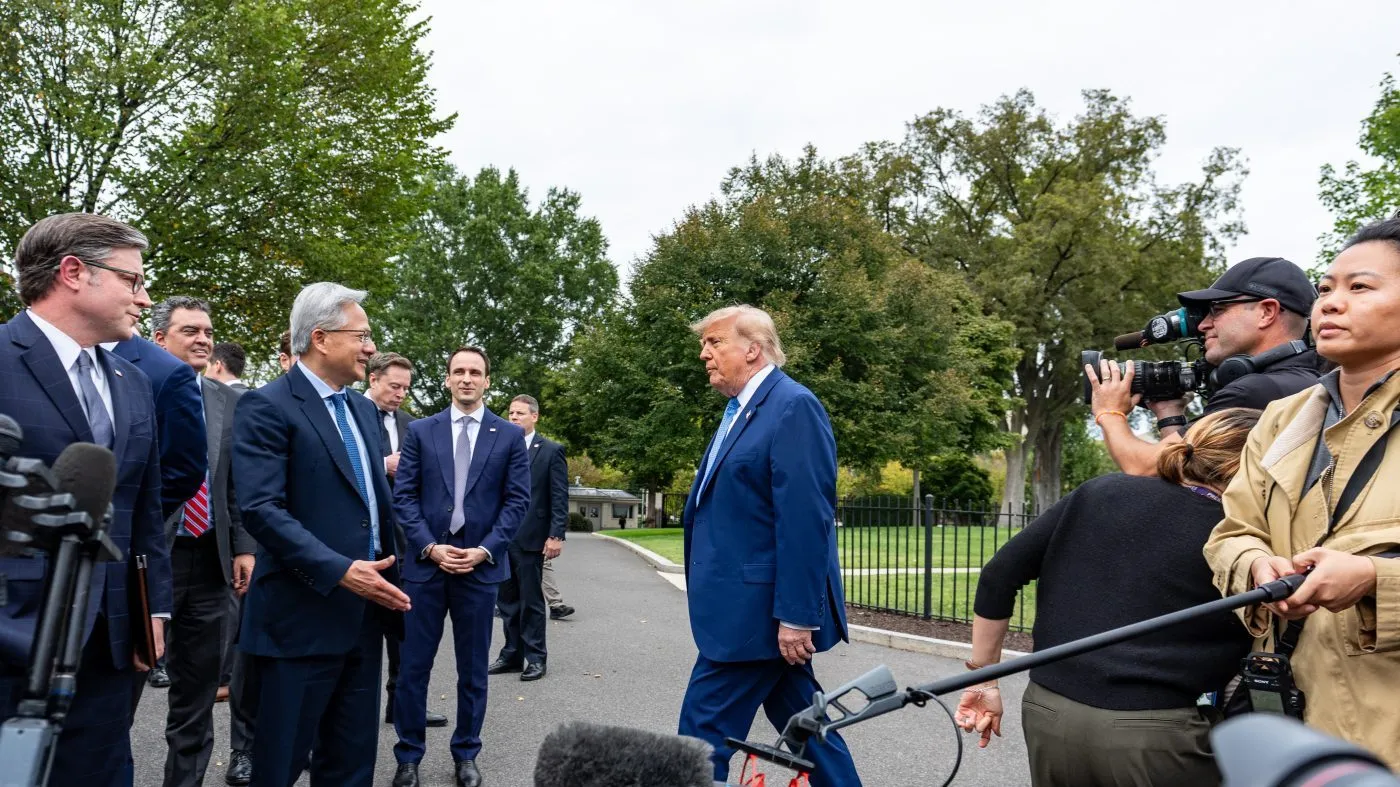President Donald Trump, center, with Speaker of the House Mike Johnson, of La., left, NVIDIA CEO Jensen Huang and others, arrives to speak with reporters outside the West Wing of the White House, Tuesday, Sept. 29, 2026, in Washington. (AP Photo/Alex Brandon)