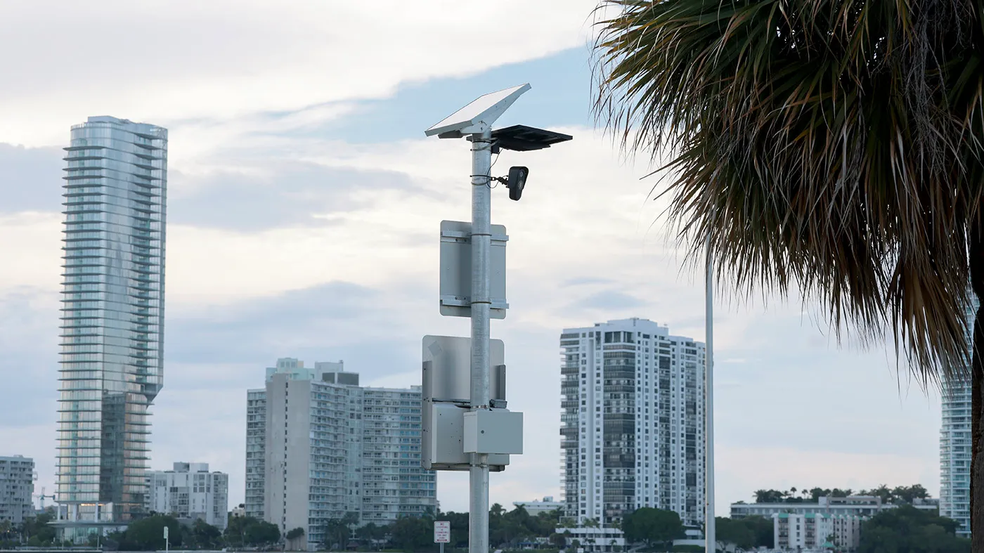 A Flock camera attached to a pole monitors passing traffic on Sept. 2, 2026, in Miami.
