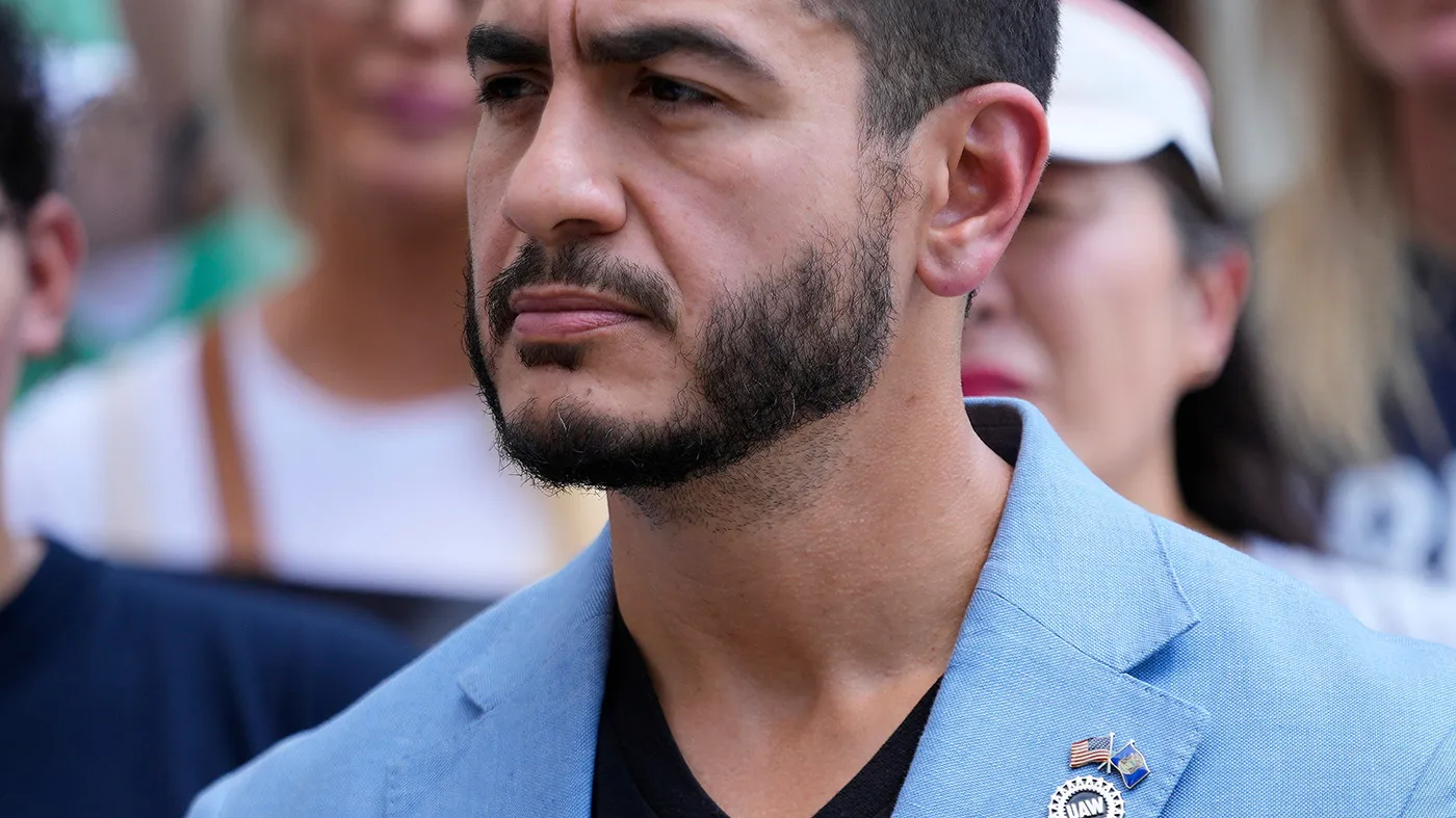Democratic nominee for U.S. Senate Abdul El-Sayed listens during a news conference at the base of the Spirit of Detroit monument in Detroit, Aug. 19, 2026.