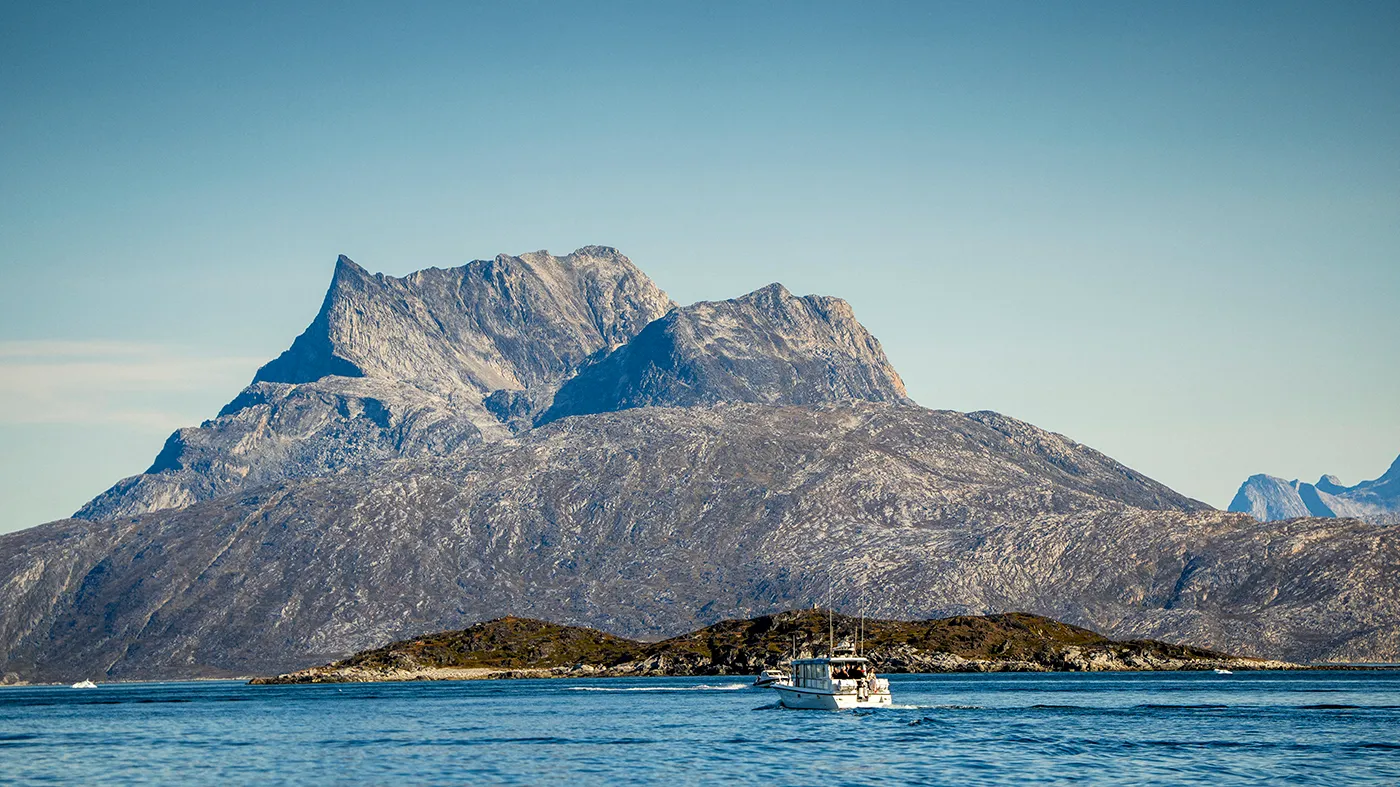 A photo taken on Sept. 6, 2026, shows a boat crossing the fjord between Nuuk and Qoornoq, Greenland.