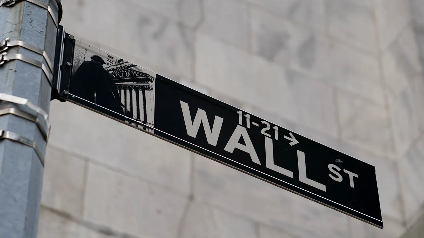 FILE – A Wall Street sign is shown in the Financial District, Wednesday, Oct. 13, 2021, in the Manhattan borough of New York. Stocks are off to a higher start on Wall Street Wednesday, May 11, 2022, and bond yields are rising after the government reported that the pace of inflation moderated last month but not as much as hoped. (AP Photo/John Minchillo, File)