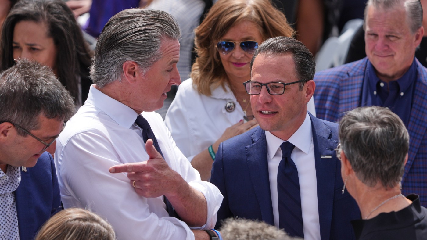 California Gov. Gavin Newsom, left, speaks with Pennsylvania Gov. Josh Shapiro ahead of the Obama Presidential Center dedication ceremony Thursday, June 18, 2026, in Chicago. (AP Photo/Jeff Roberson)