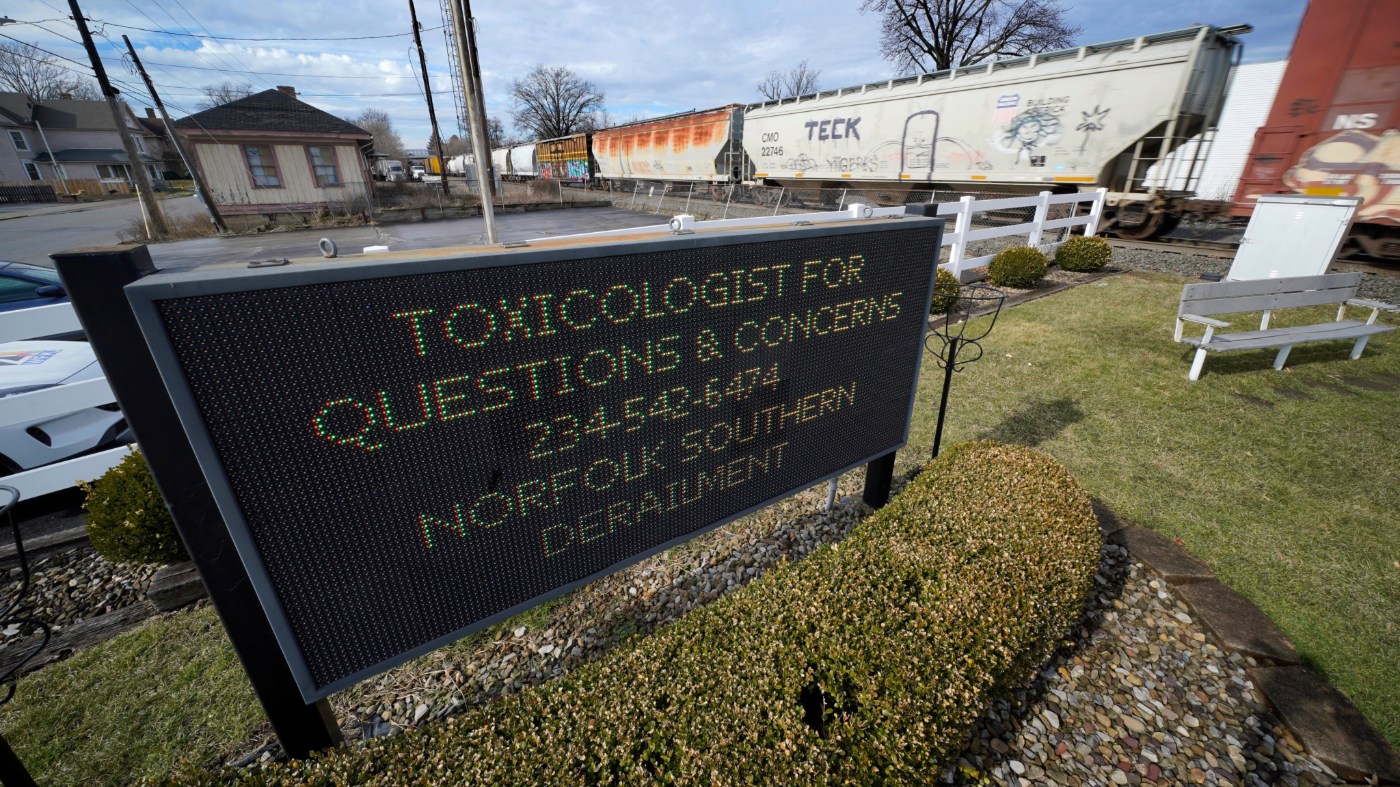 A Norfolk Southern freight train passes through East Palestine, Ohio, Thursday, Feb. 9, 2023, as clean up continues following a derailment Friday night. (AP Photo/Gene J. Puskar)